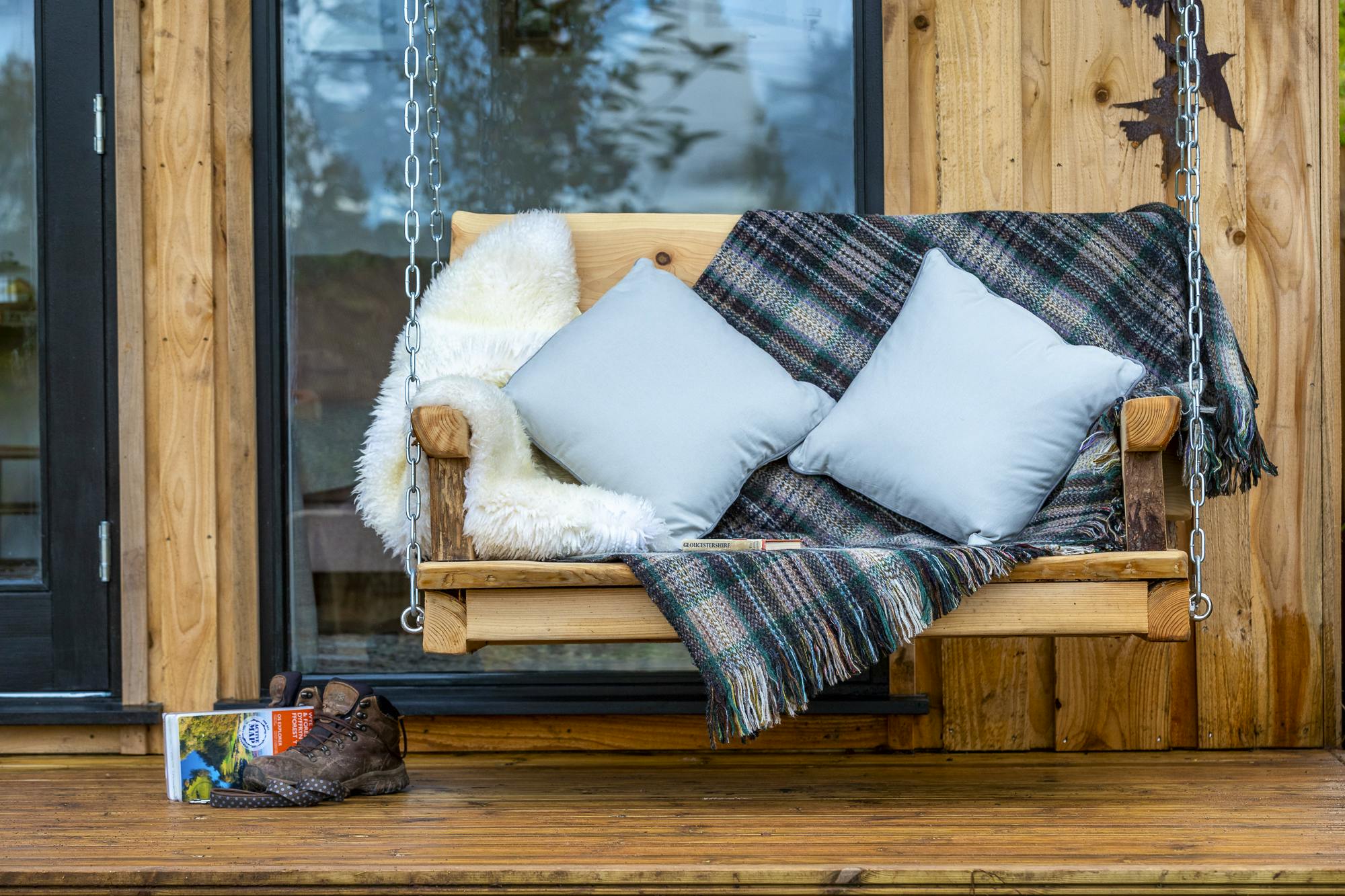 Swing seat on the cabin veranda