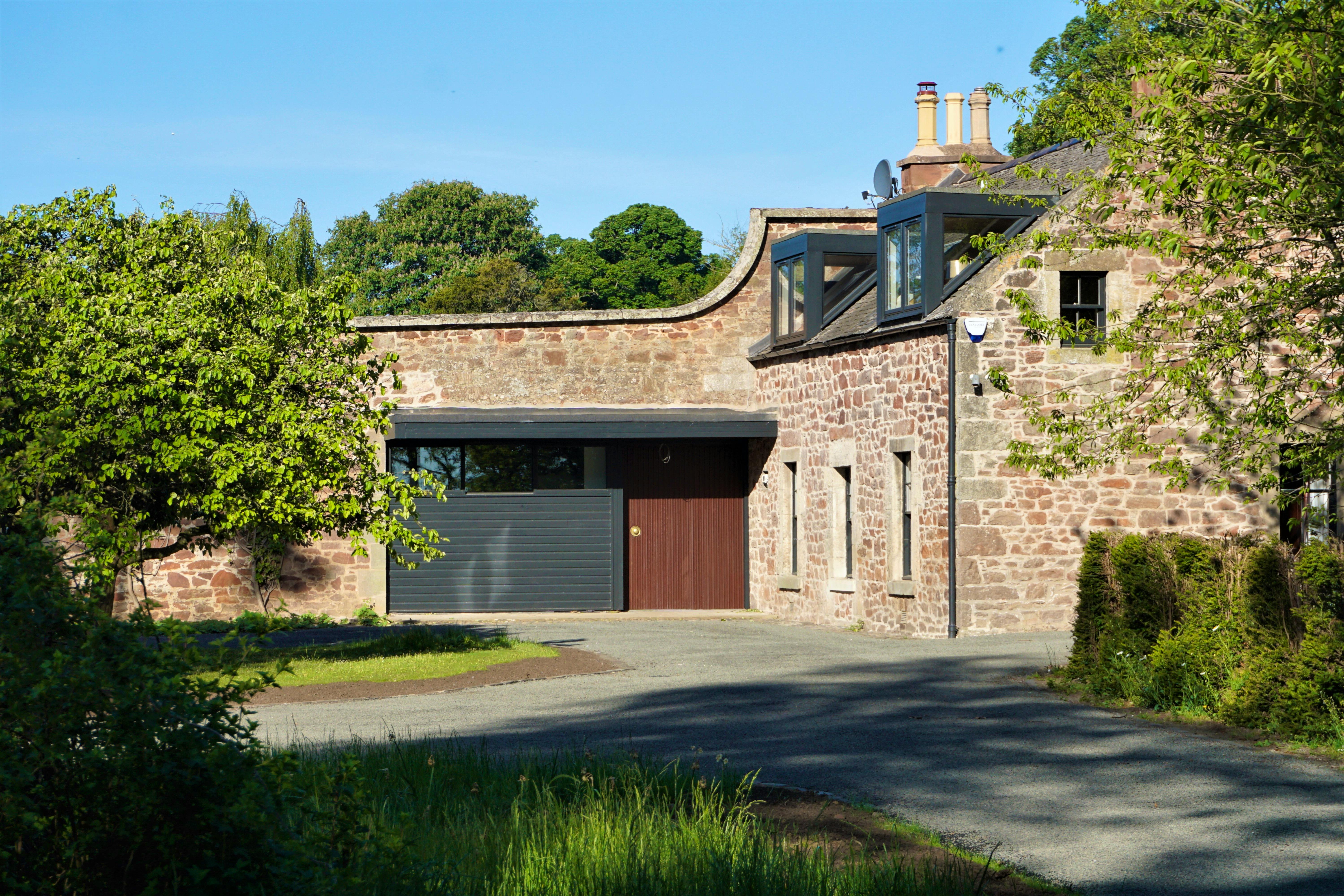 The house incorporates a 200 year old garden cottage