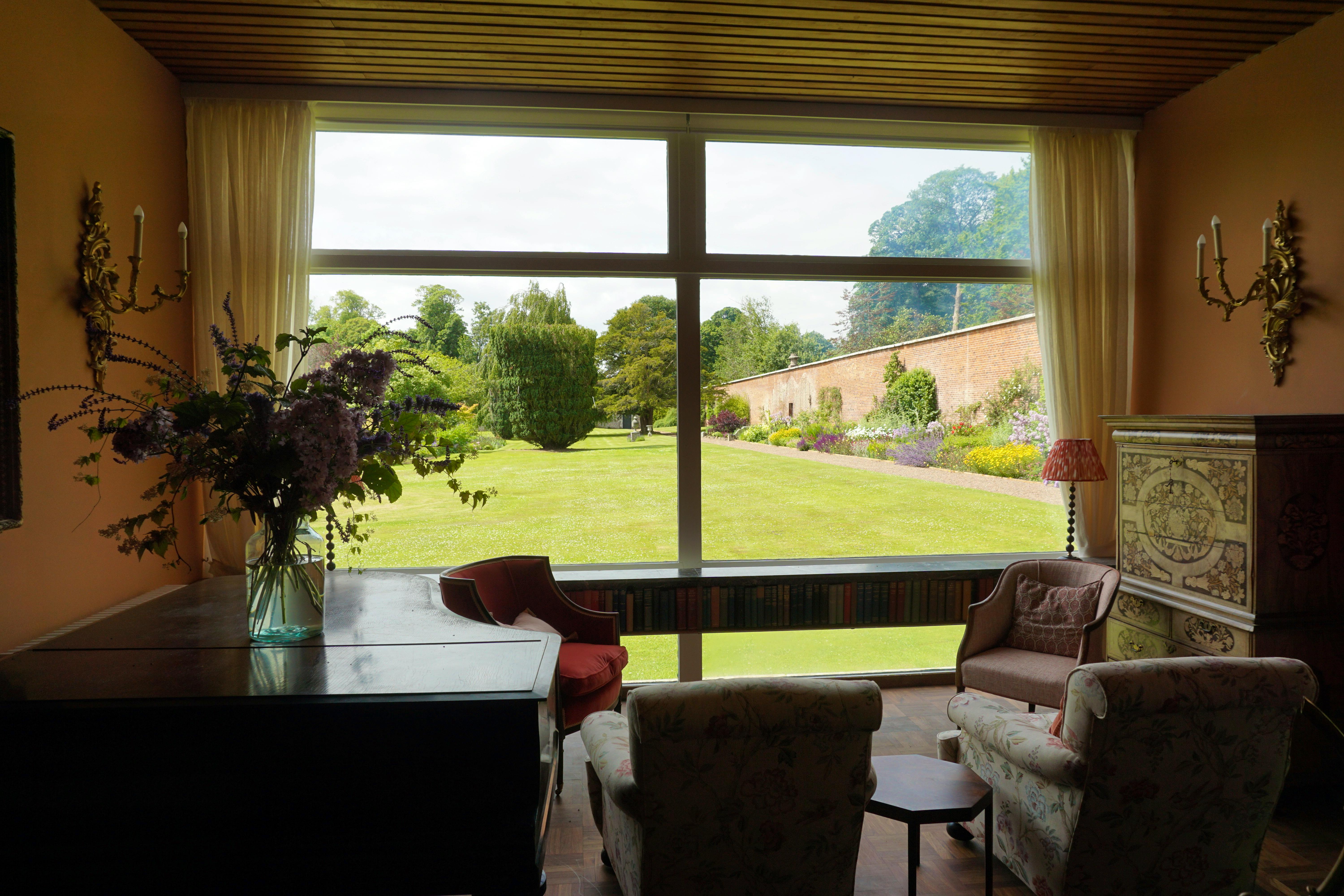 The modern house has huge windows looking out onto the garden