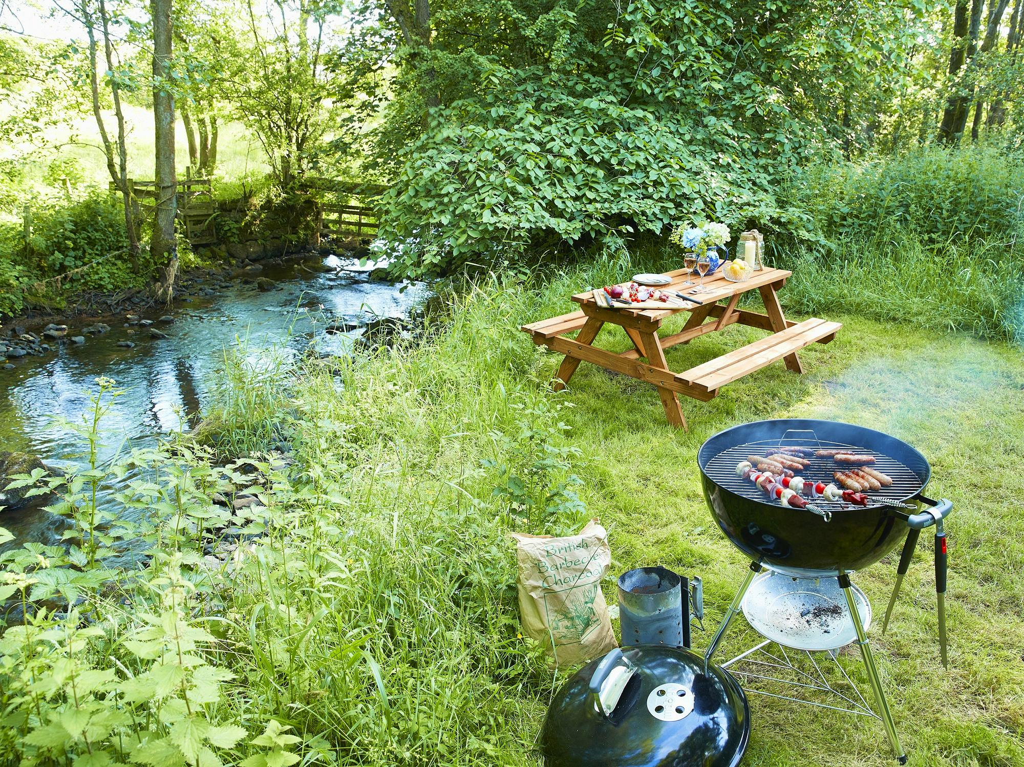 Elm Retreat riverfront access with picnic table and Weber charcoal BBQ complimentary locally sourced charcoal provided for guest use