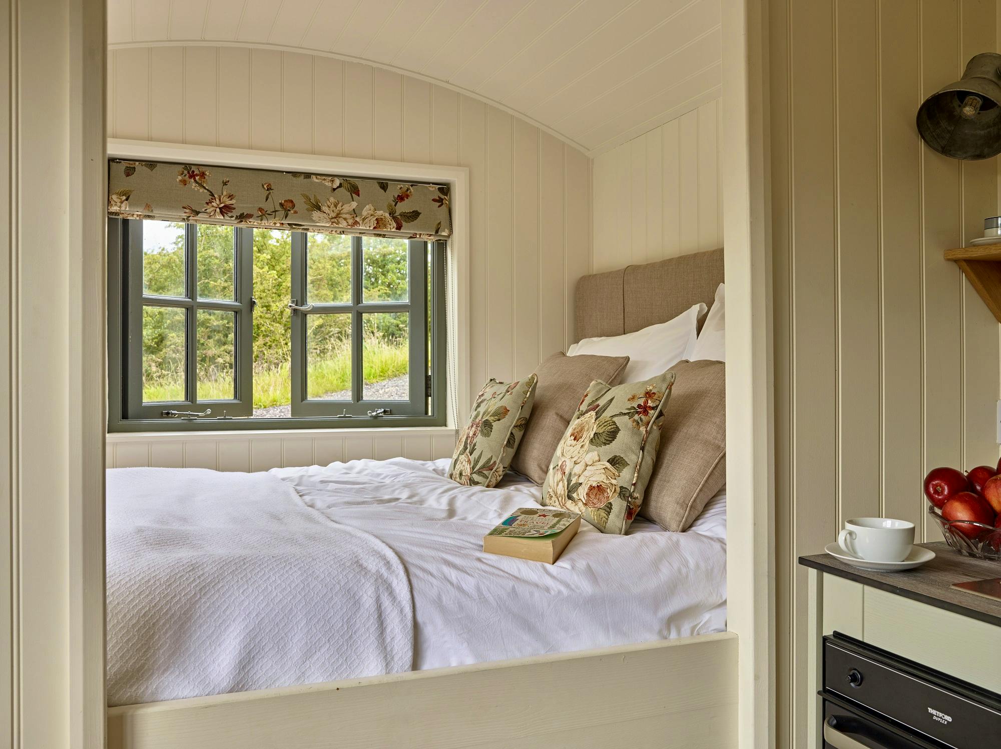 Hawthorn Retreat king size bed in shepherds hut overlooking River Petteril LPG heating and hot water