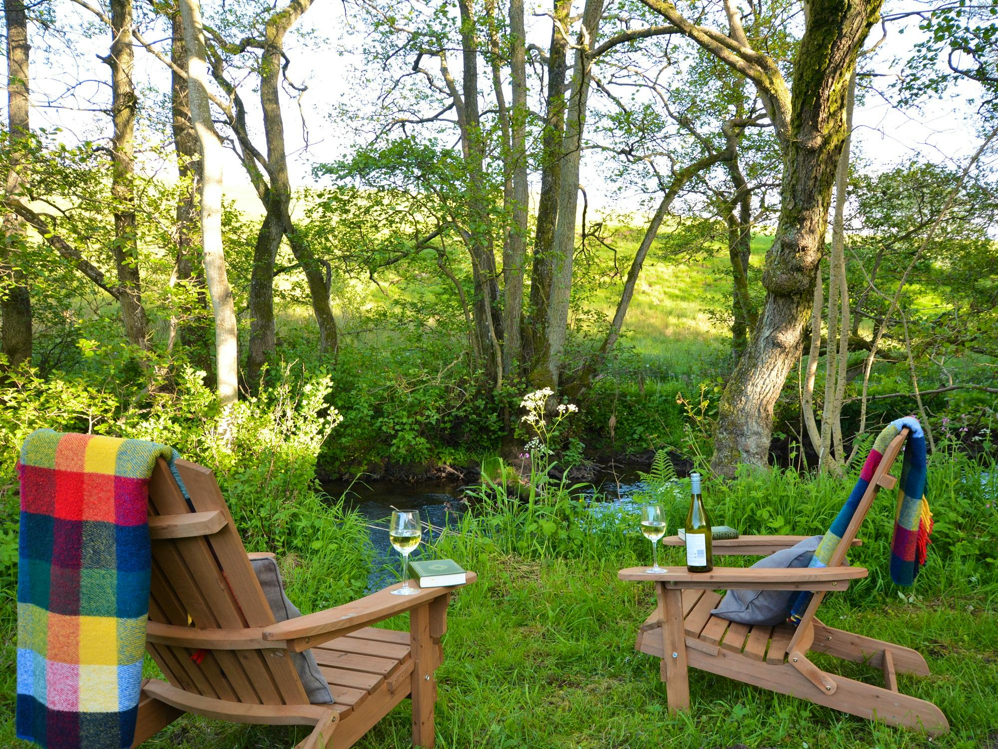 Relax by the River Petteril at the shepherds huts near Blencowe Hall at the Rowley Estates
