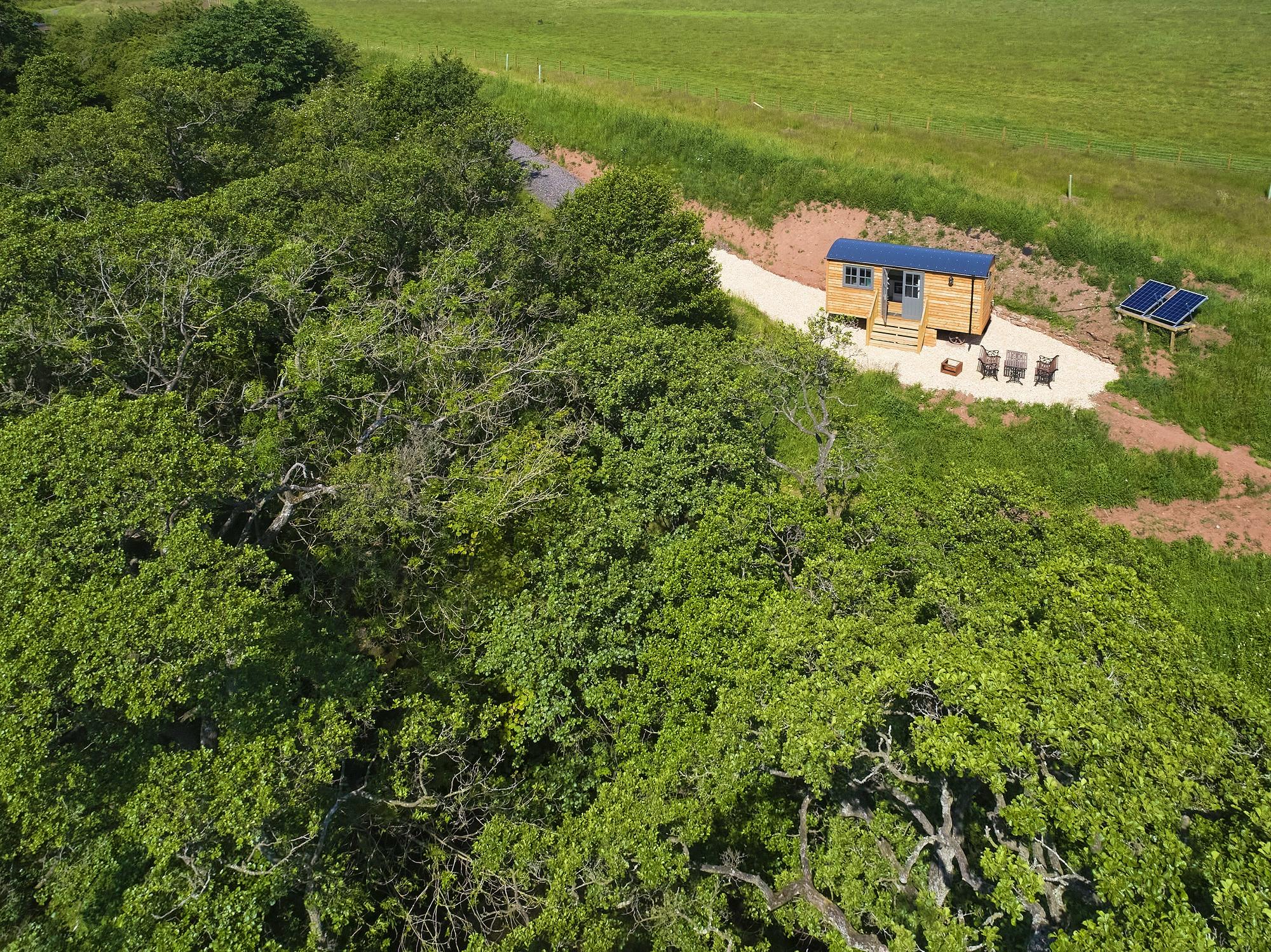 Rowan Retreat Shepherds Hut set in woodland with wooded private riverfront access LPG heat and solar power