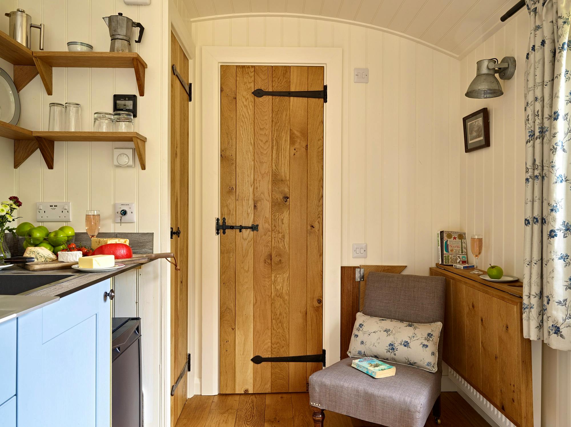Rowan Retreat ensuite shepherds hut with breakfasting table folded down for relaxation corner