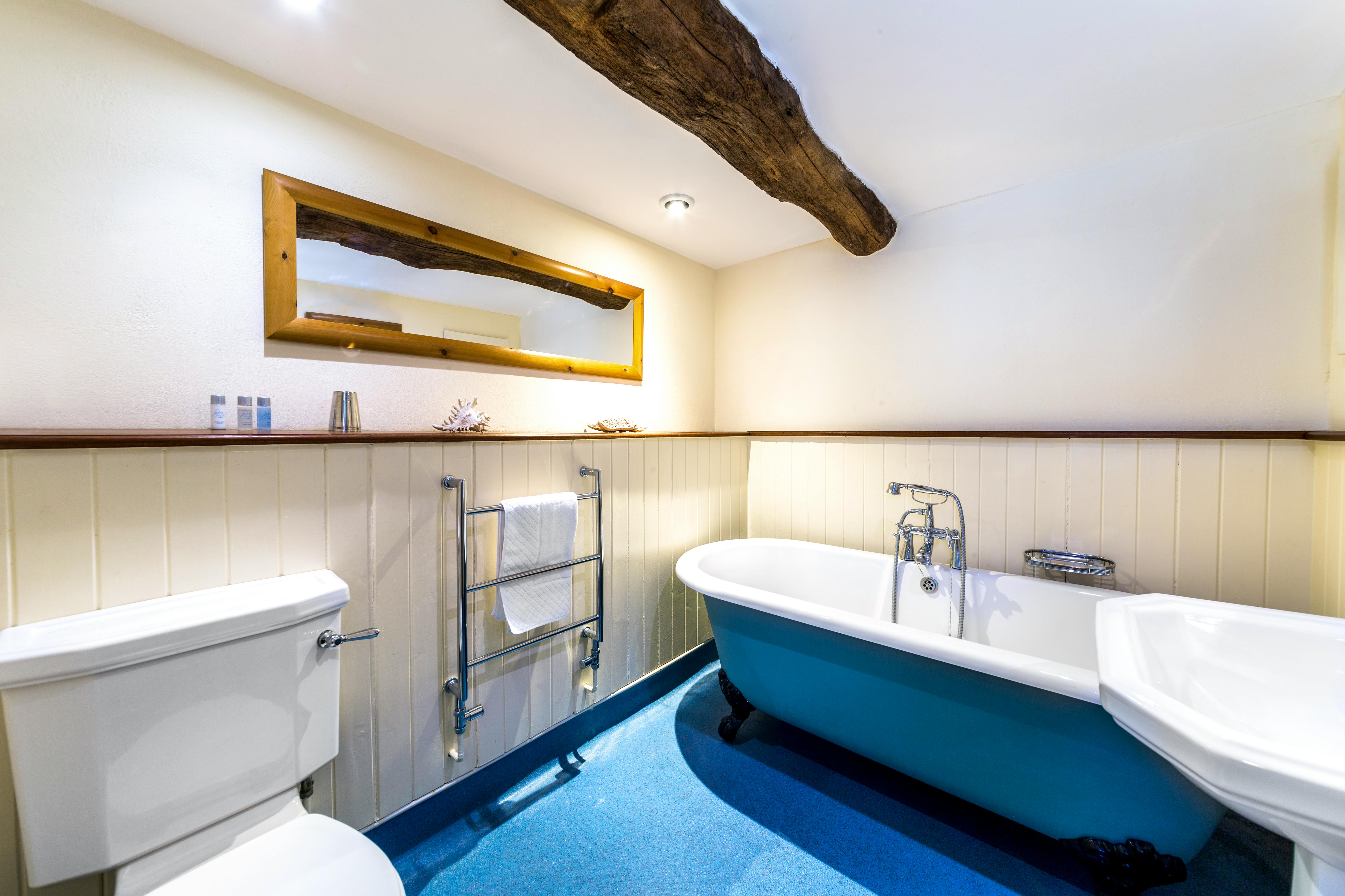 Thatched ensuite with roll-top bath