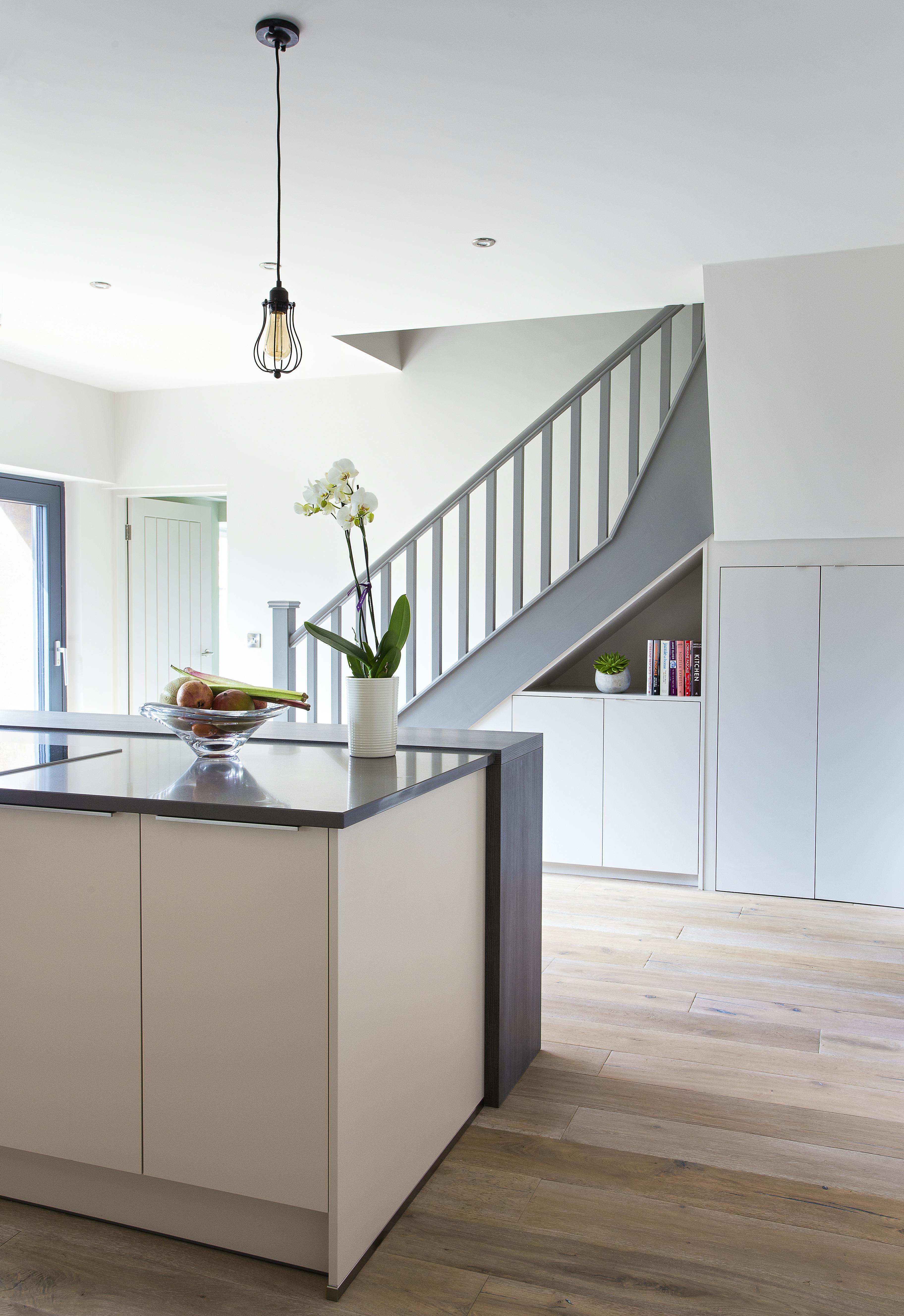 Kitchen with staircase leading up to Master bedroom and ensuite