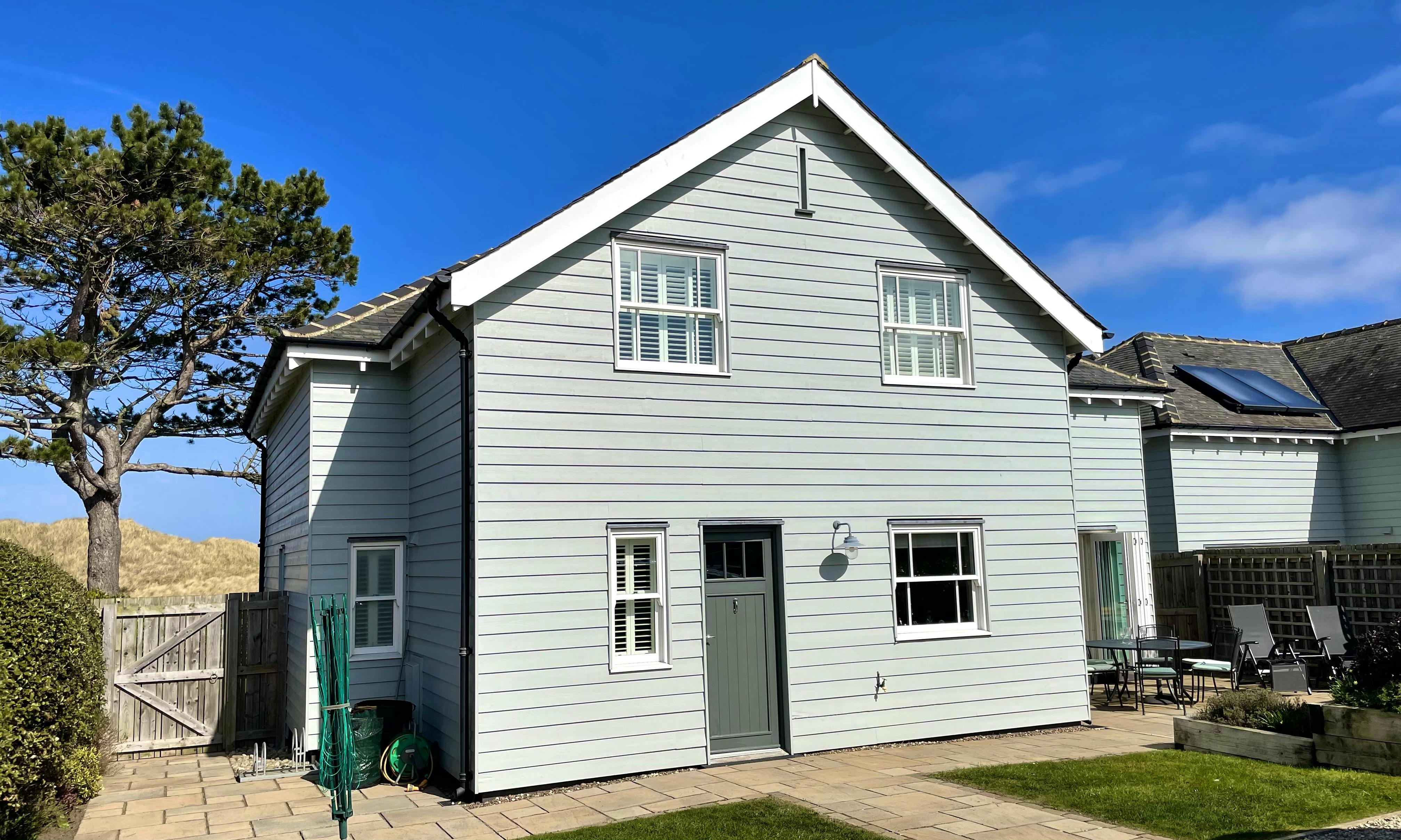The back garden at Waterford has secure off road parking, a sheltered patio and bolted down bike rack