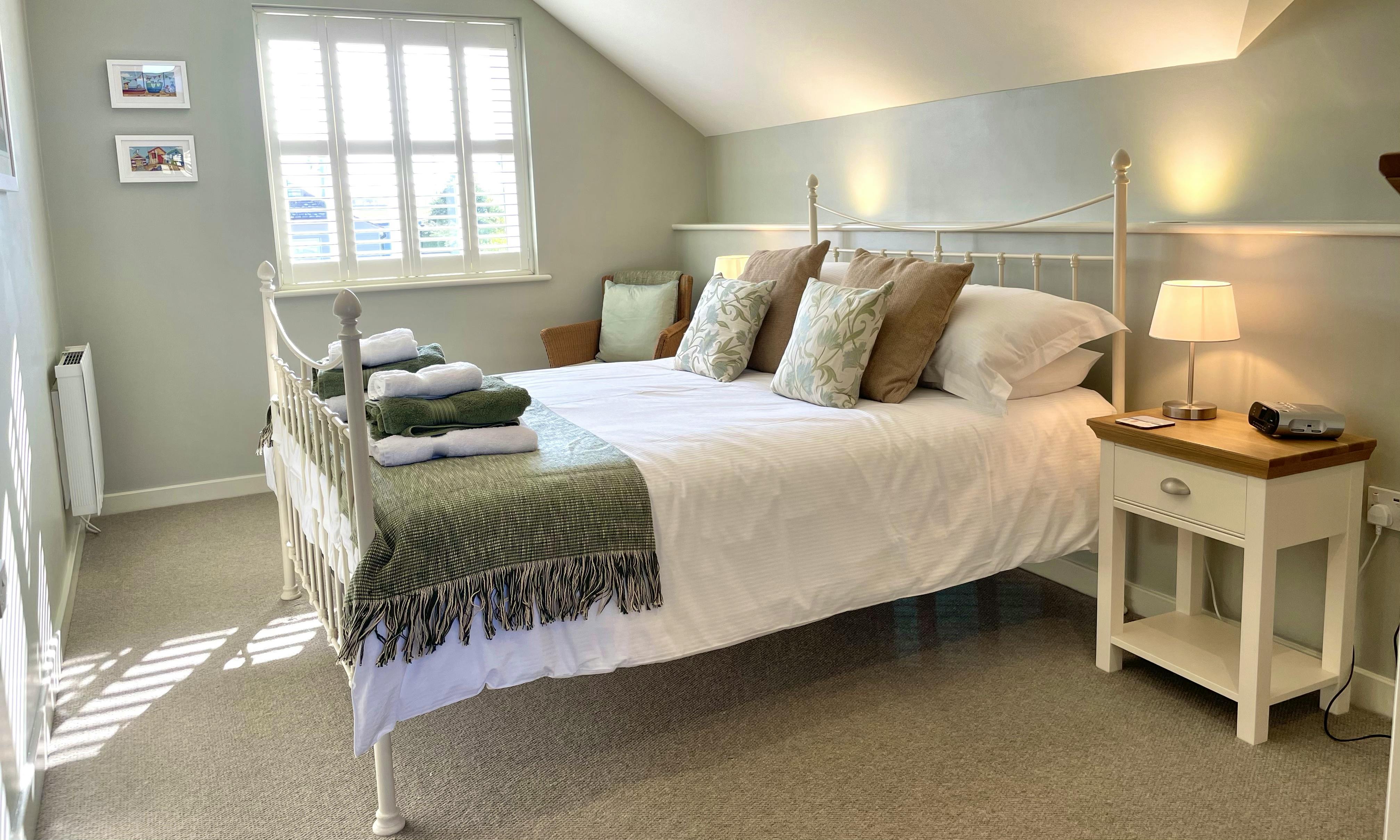 The King Bedroom in Waterford, with a walk-in wardrobe and stylish king sized bedstead