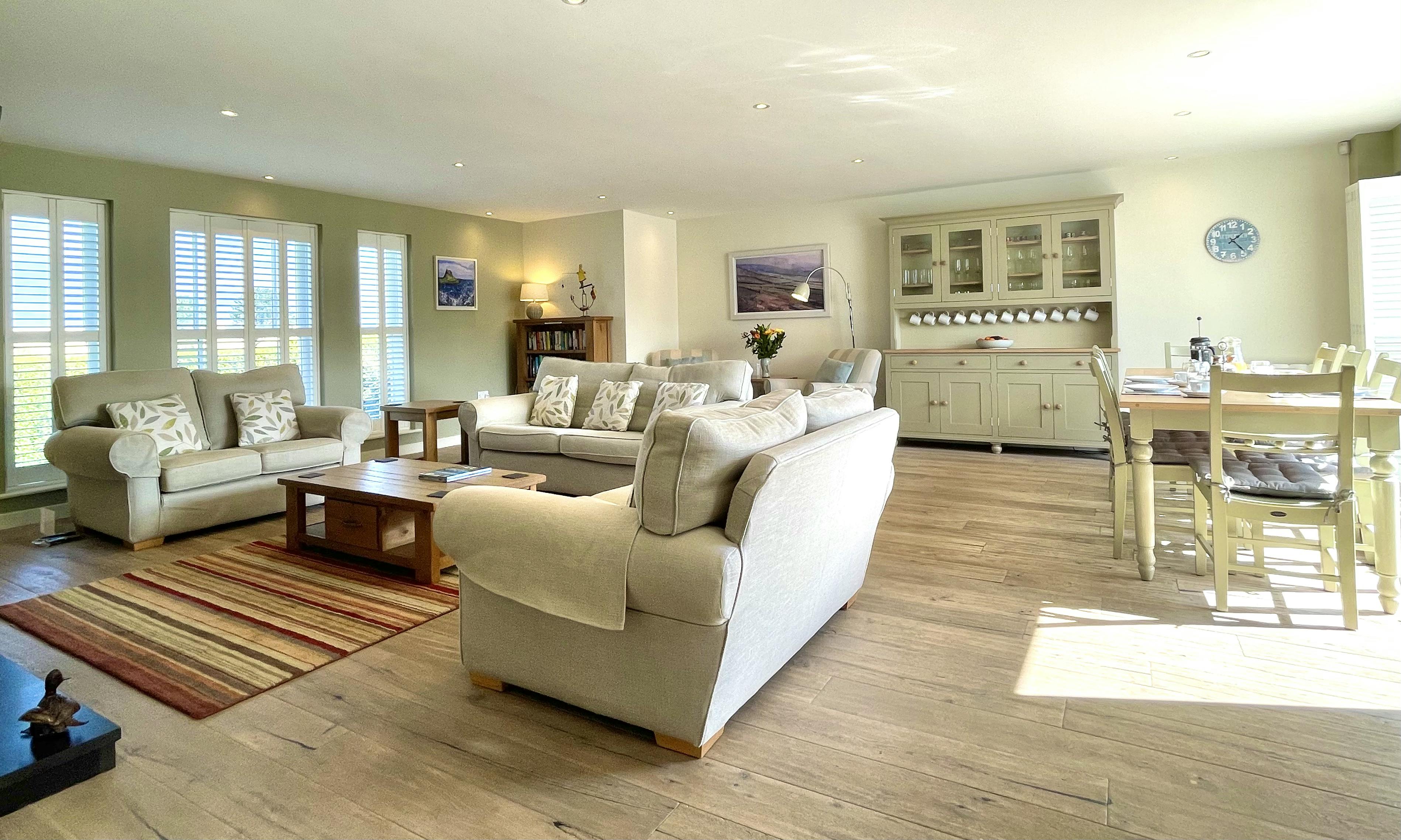The Open Plan Living Space is light and airy in Waterford, with big comfortable sofas and contemporary log burner