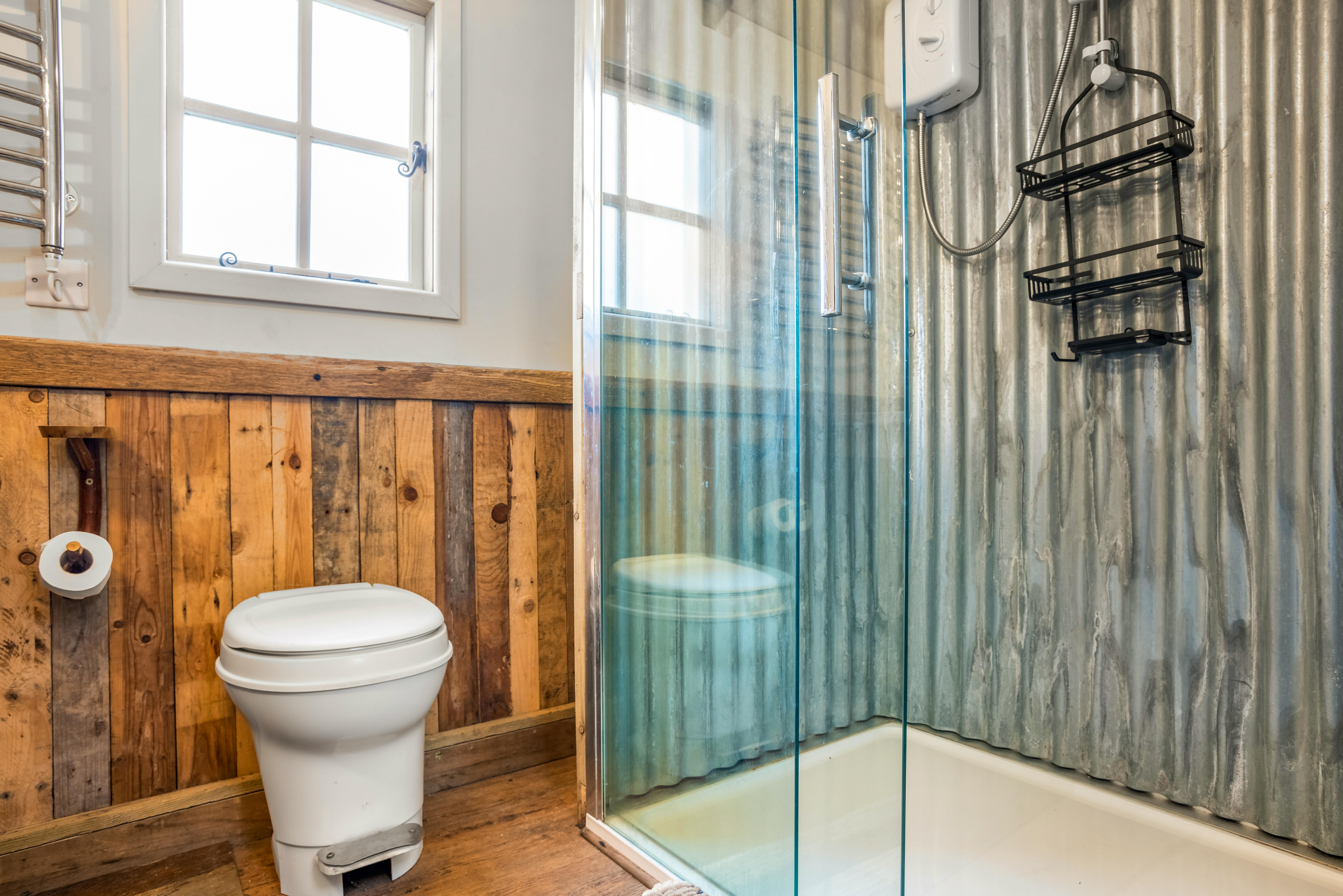 Electric shower in bathroom area