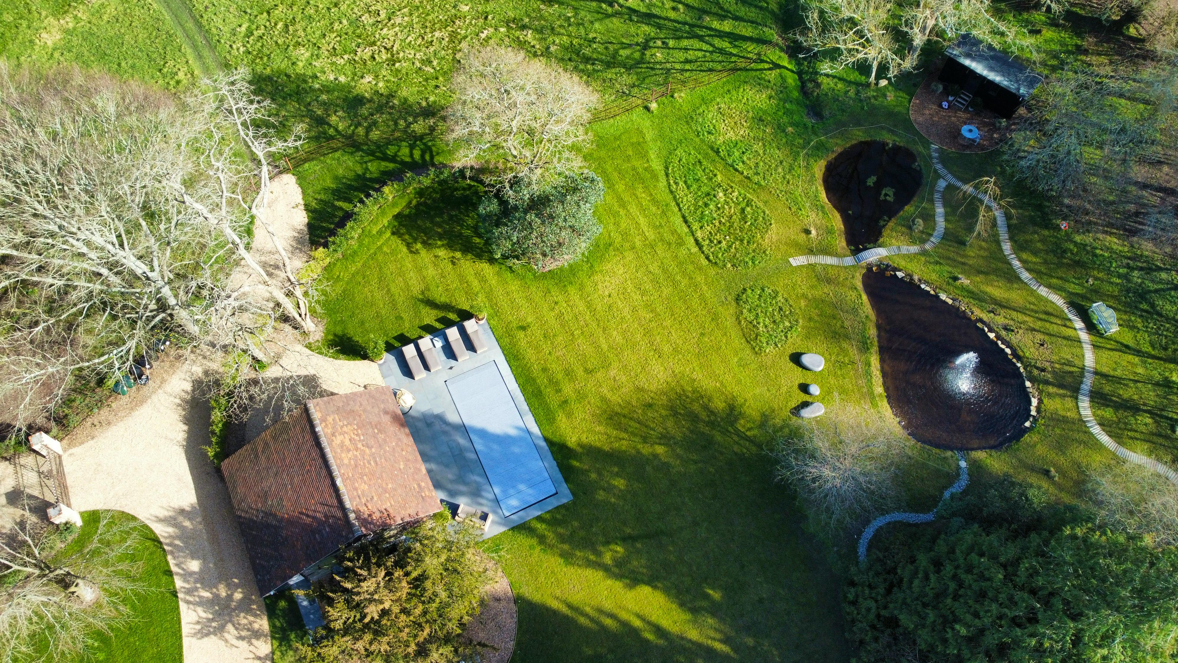 Aerial of Pool, Lake & Cabin
