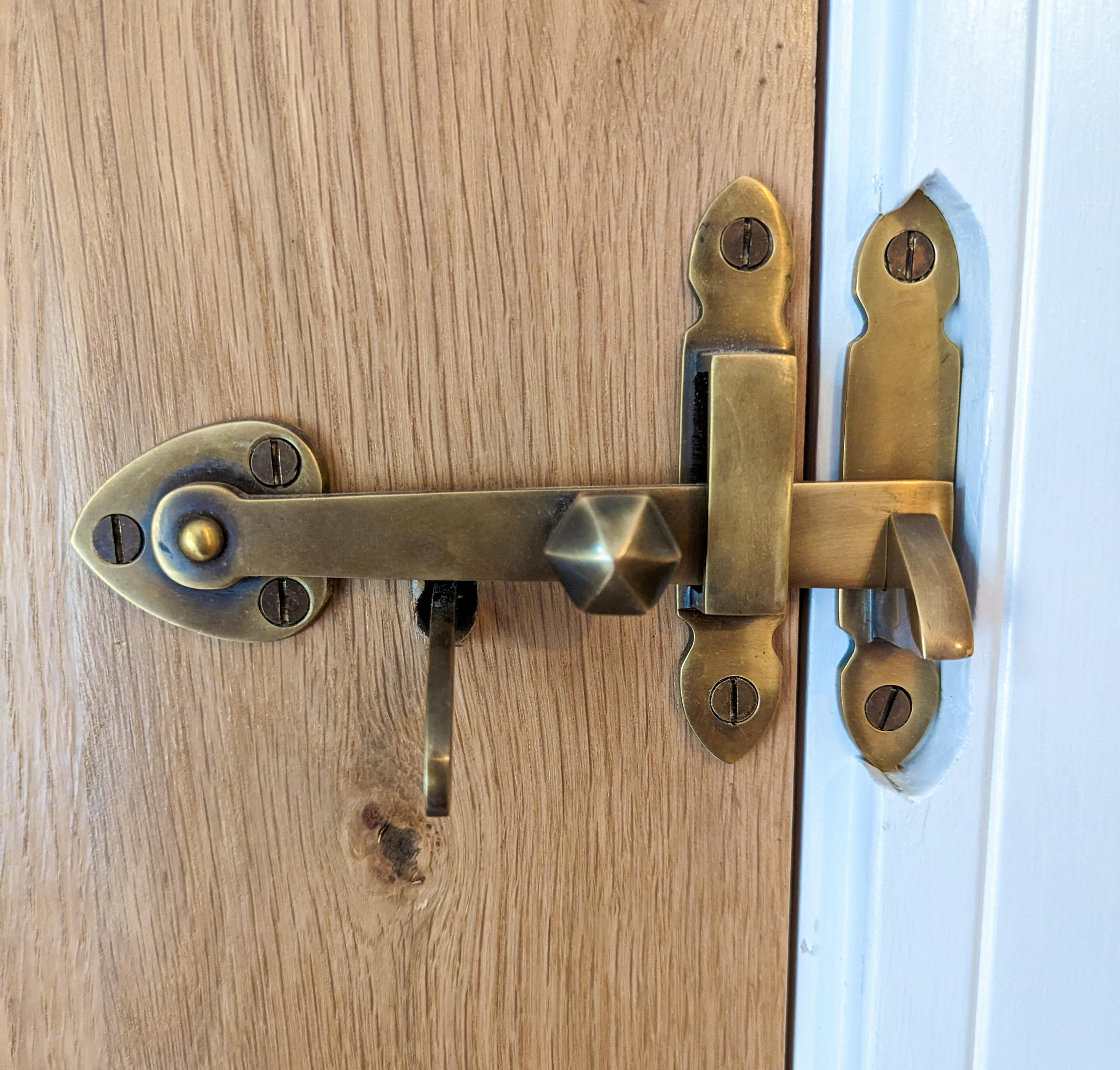Brass Suffolk latches on oak doors