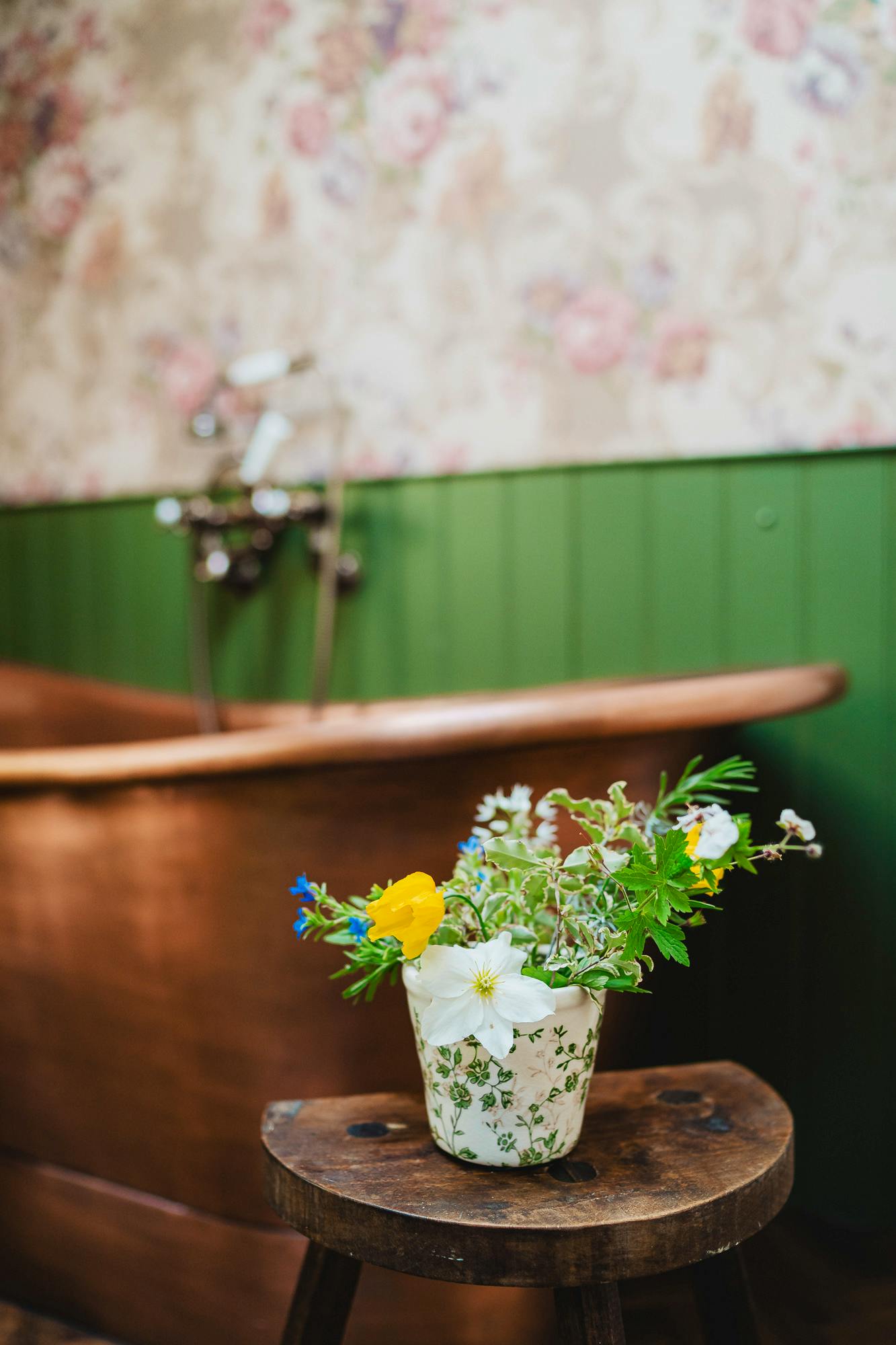 Fresh flowers by the copper bath 