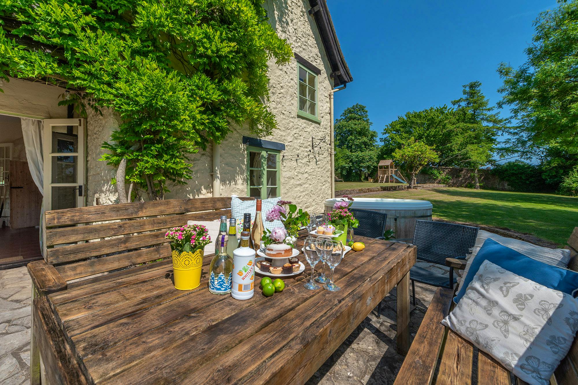 Pretty patio with hot tub and BBQ