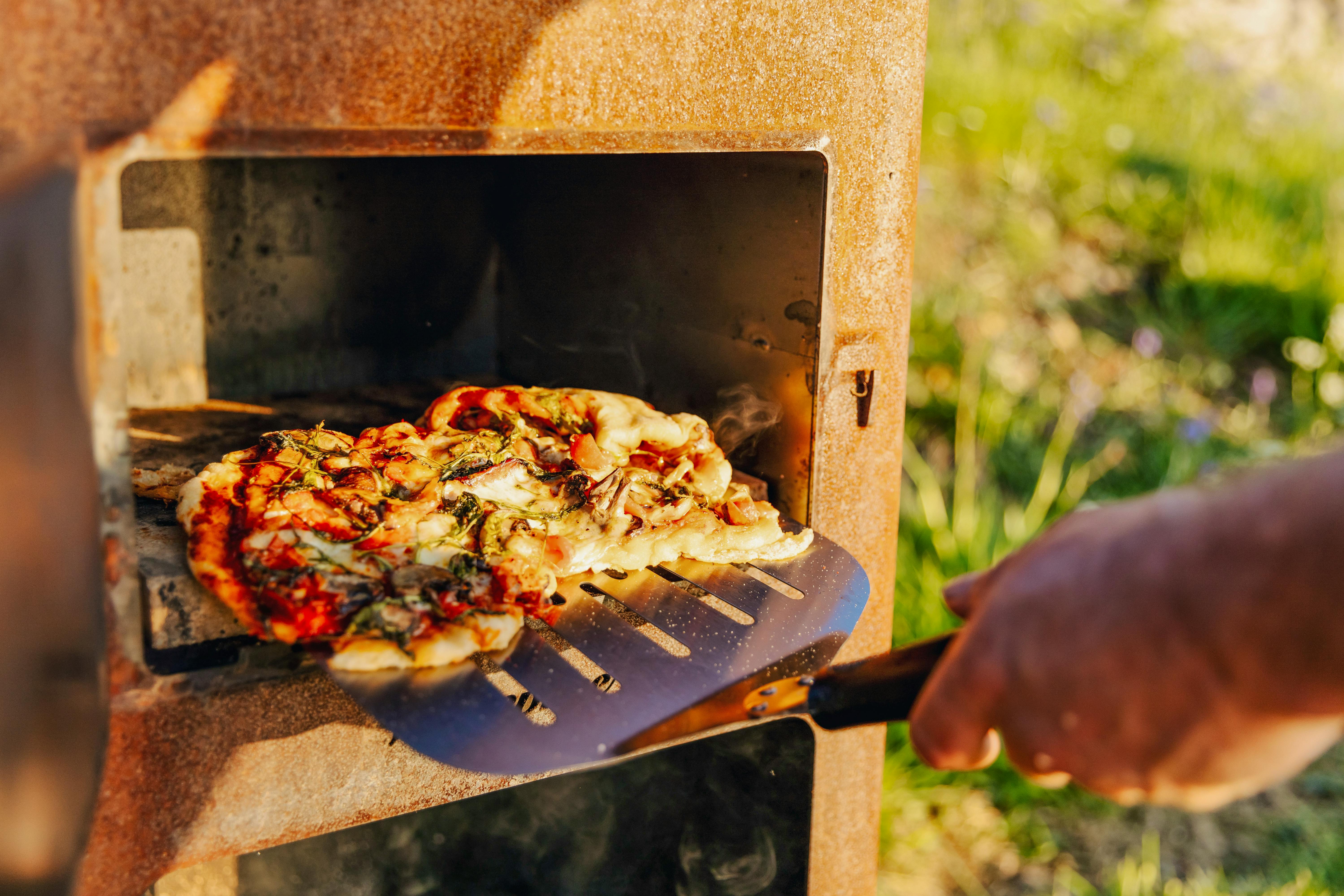 Cooking outside in the pizza oven