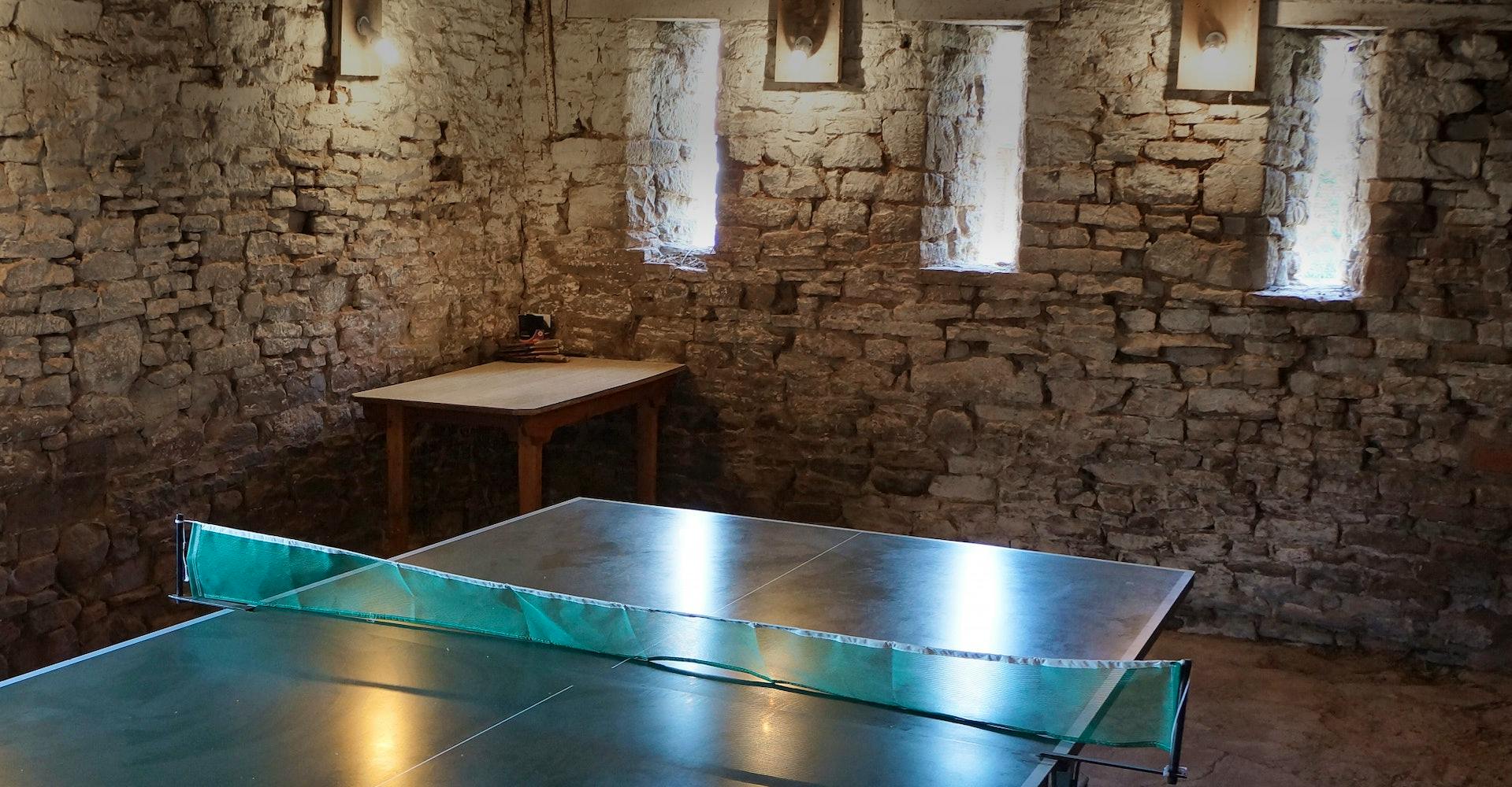 Rustic table tennis in outbuildings