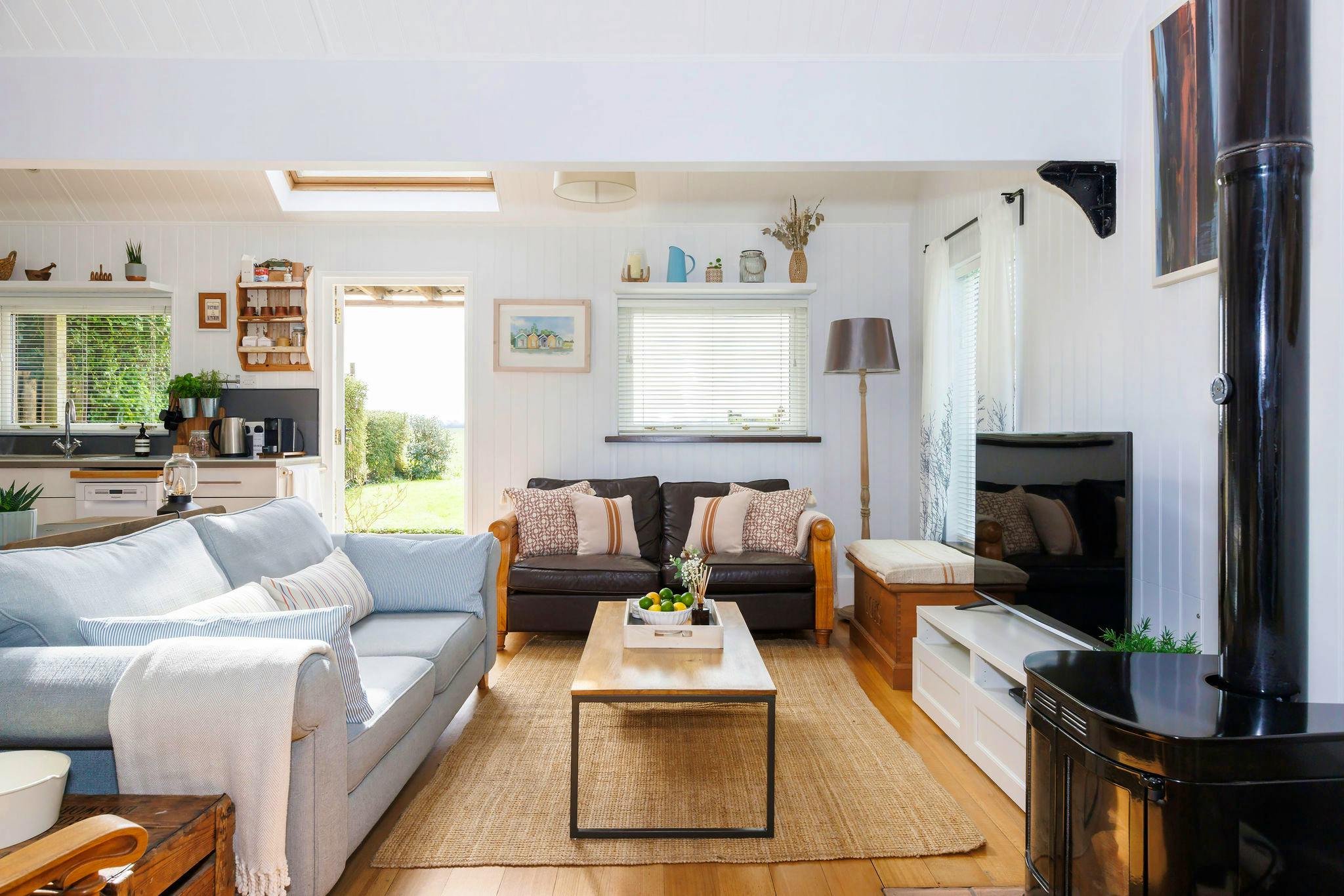 Lounge area with log burner & TV