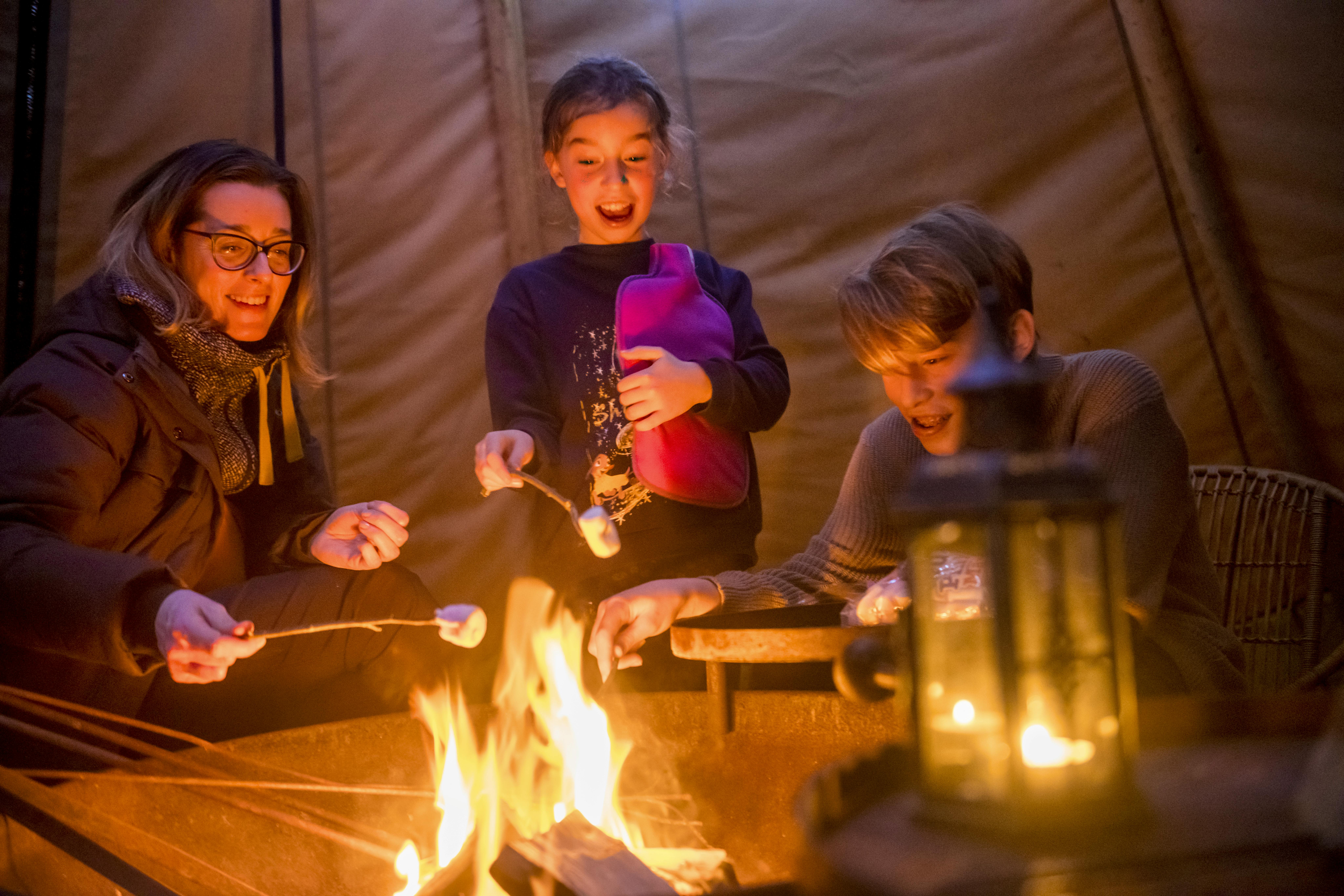 toasting marshmallows in tipi