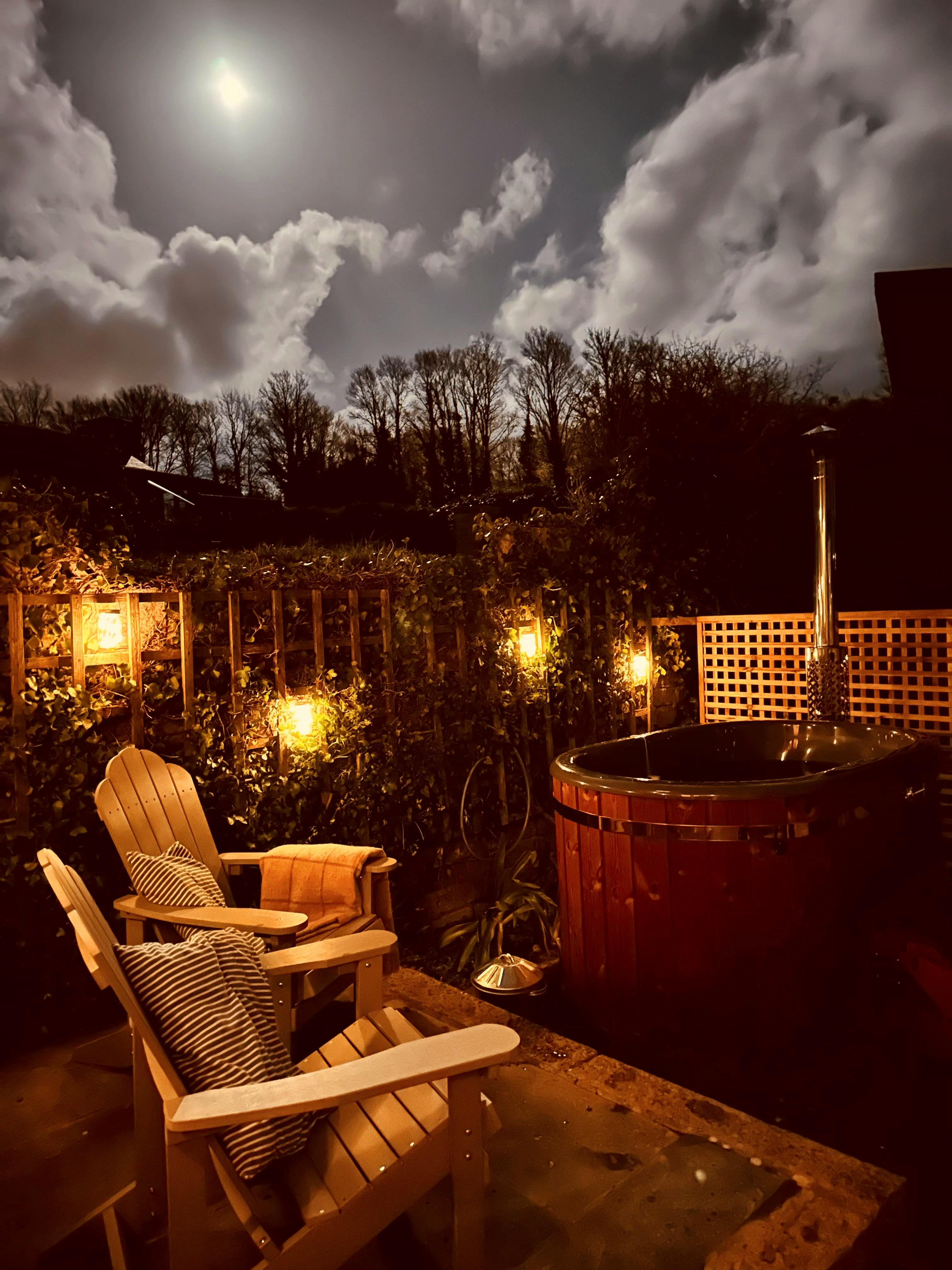 Wood fired hot tub at night