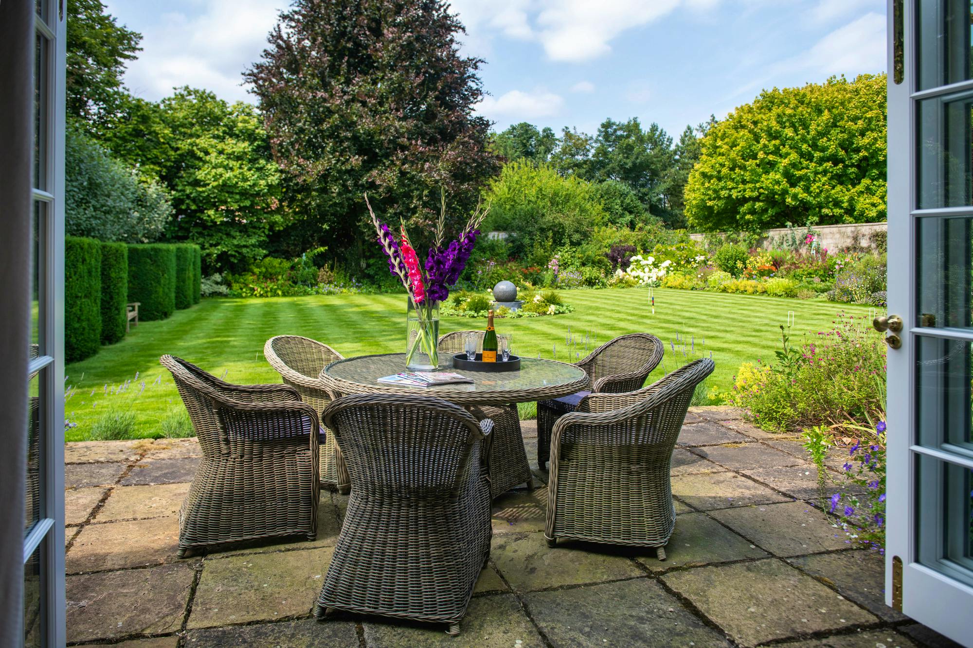 Pre-supper drinks in walled garden 