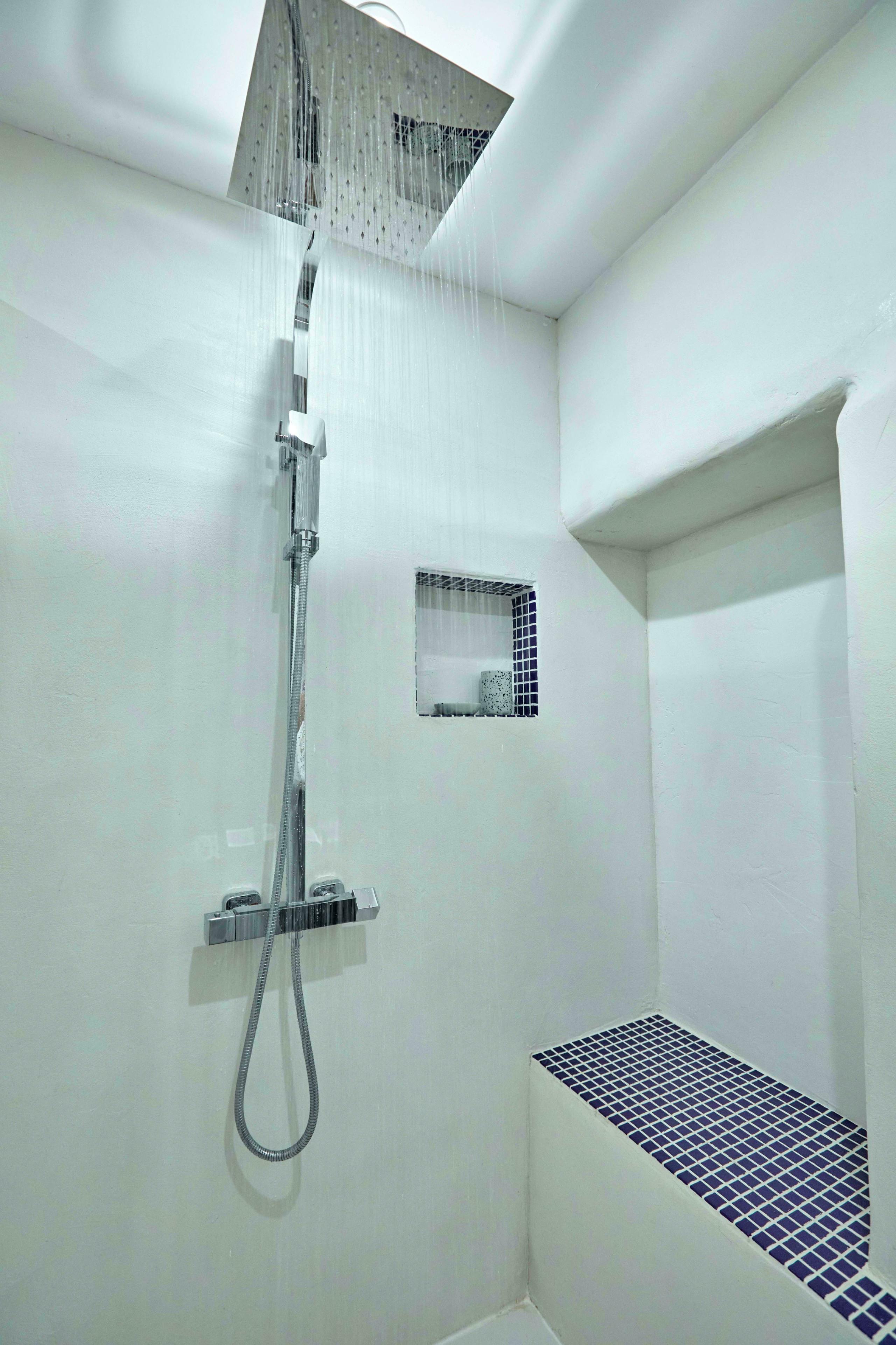 Waterfall shower and seating.