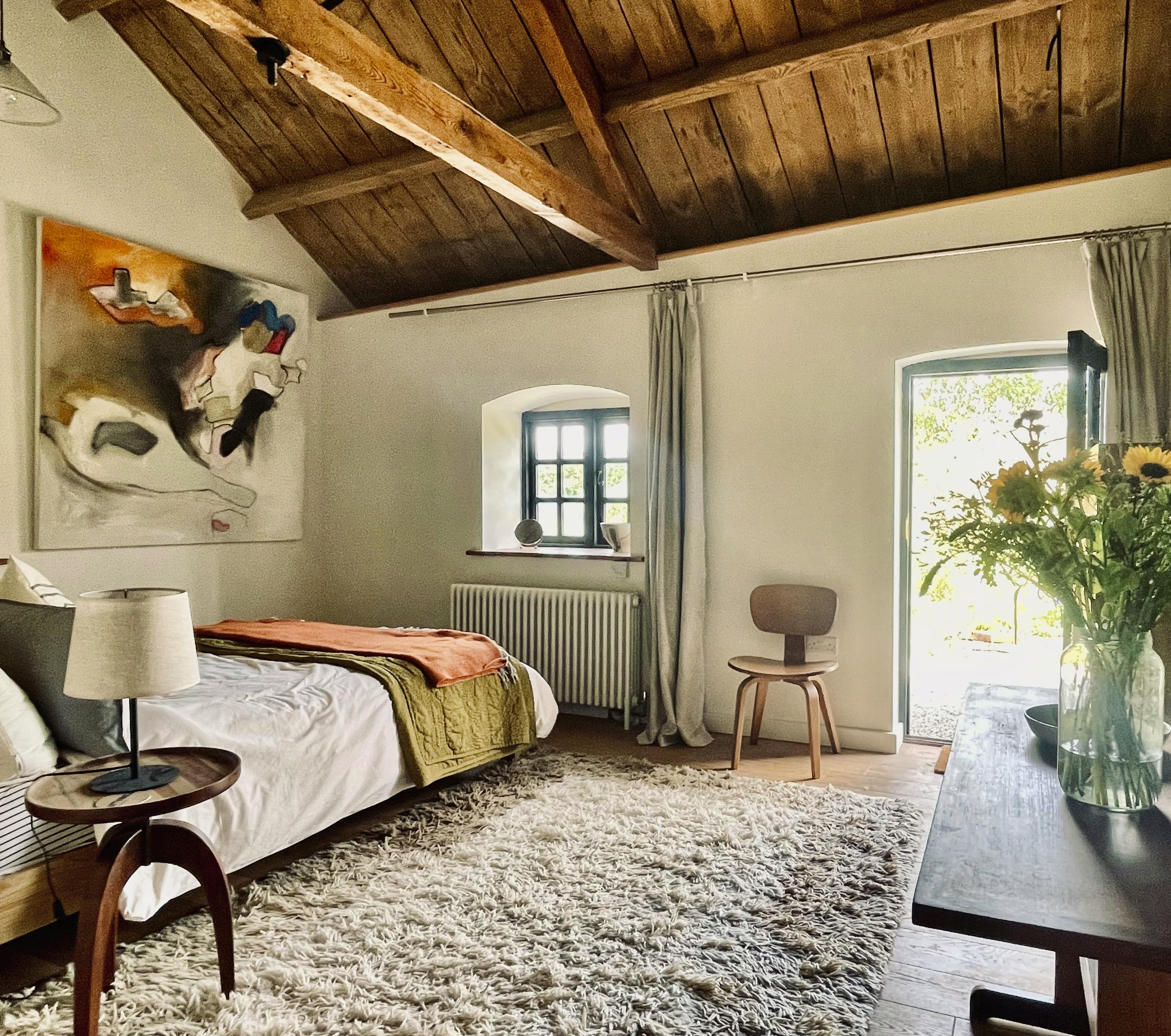 Spacious bedroom opens to garden