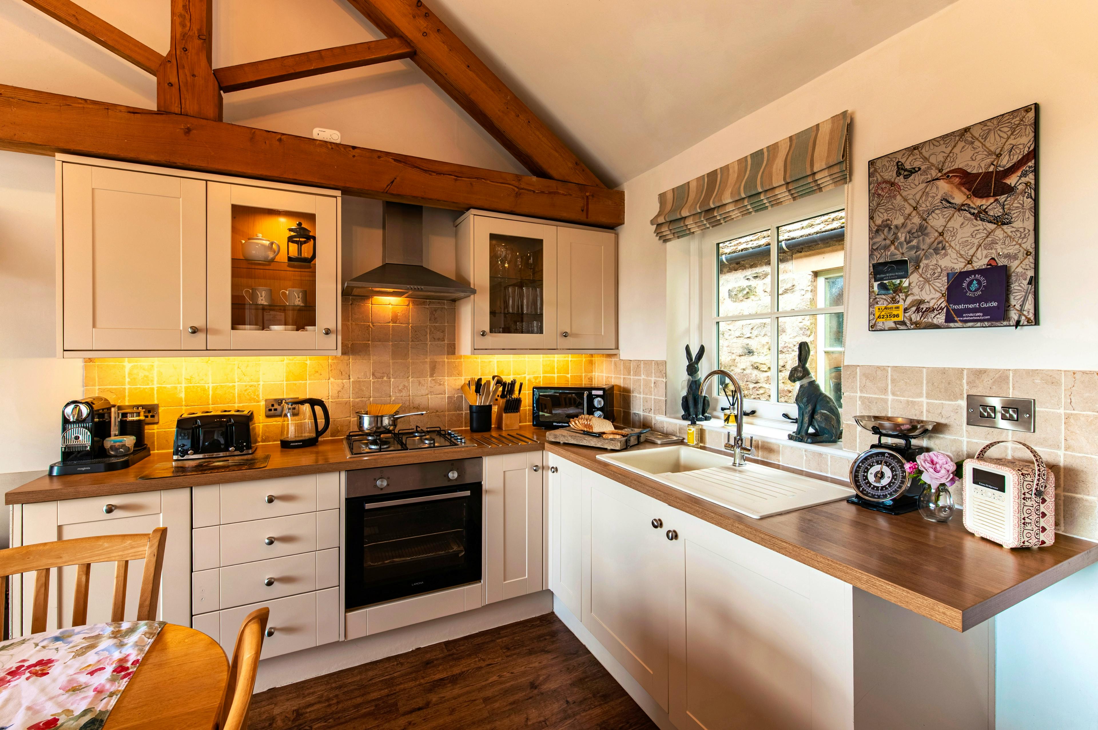 Open plan kitchen with log fire