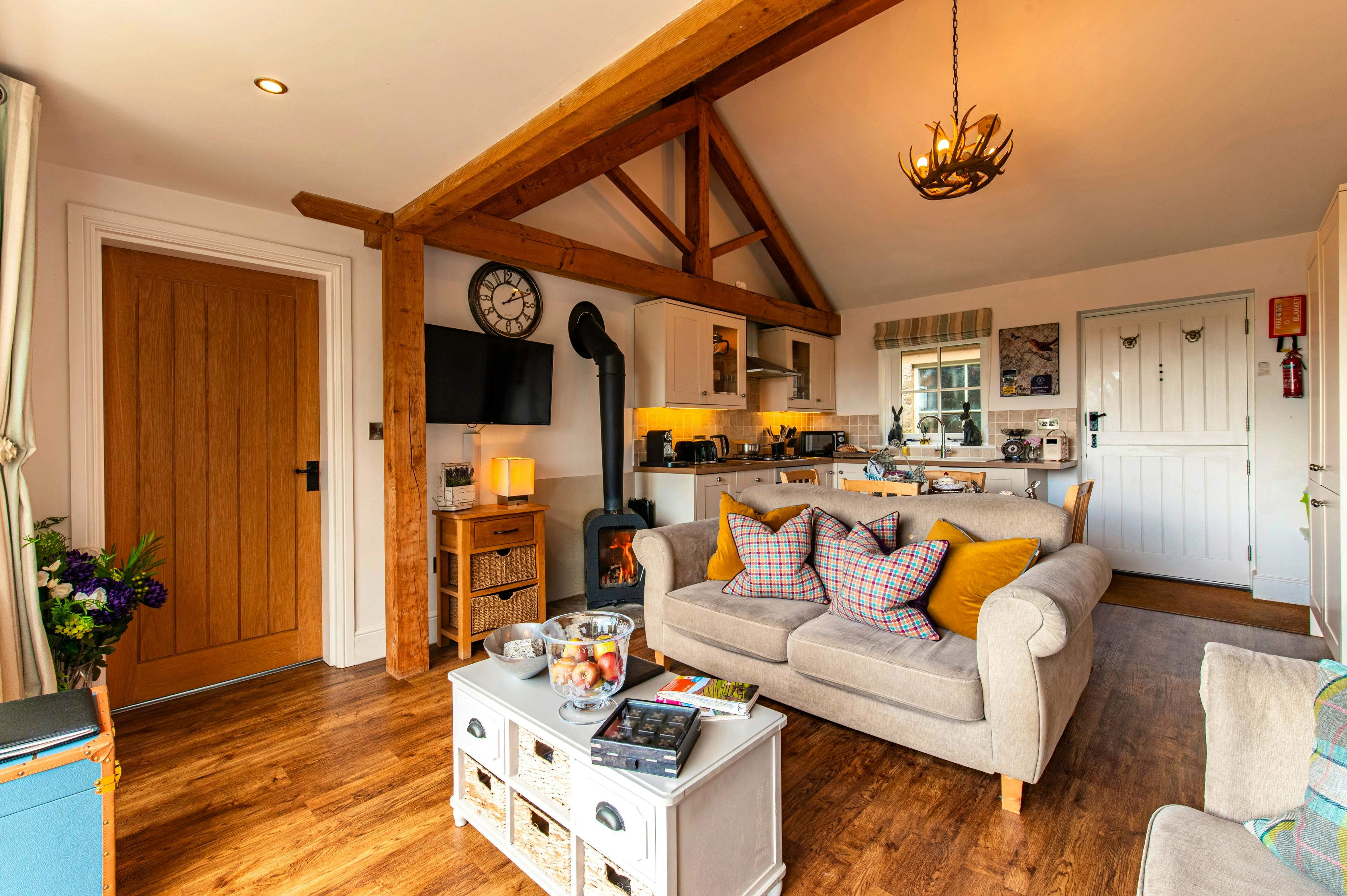 Open plan kitchen with log fire