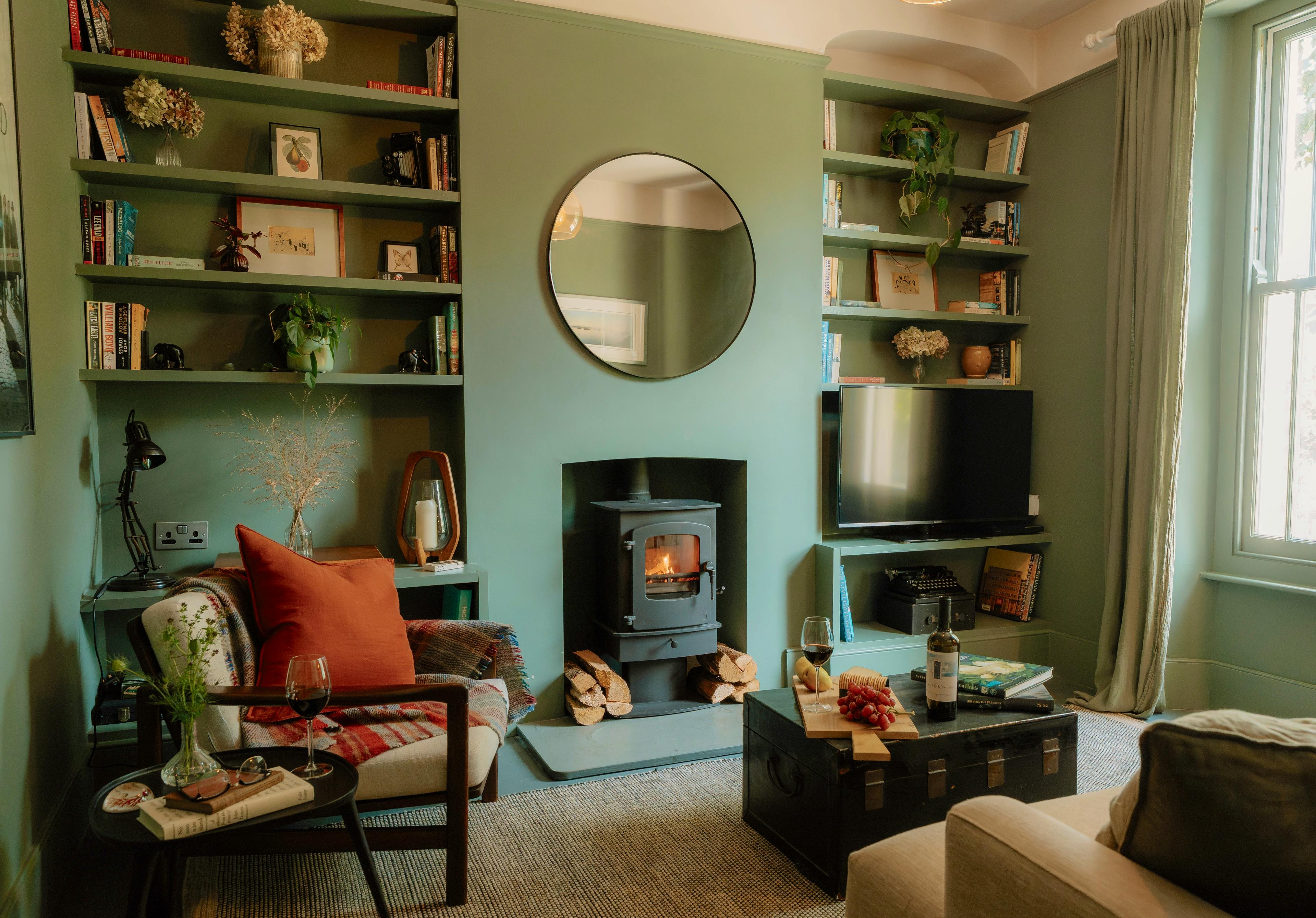 Cosy sitting room with wood burner.