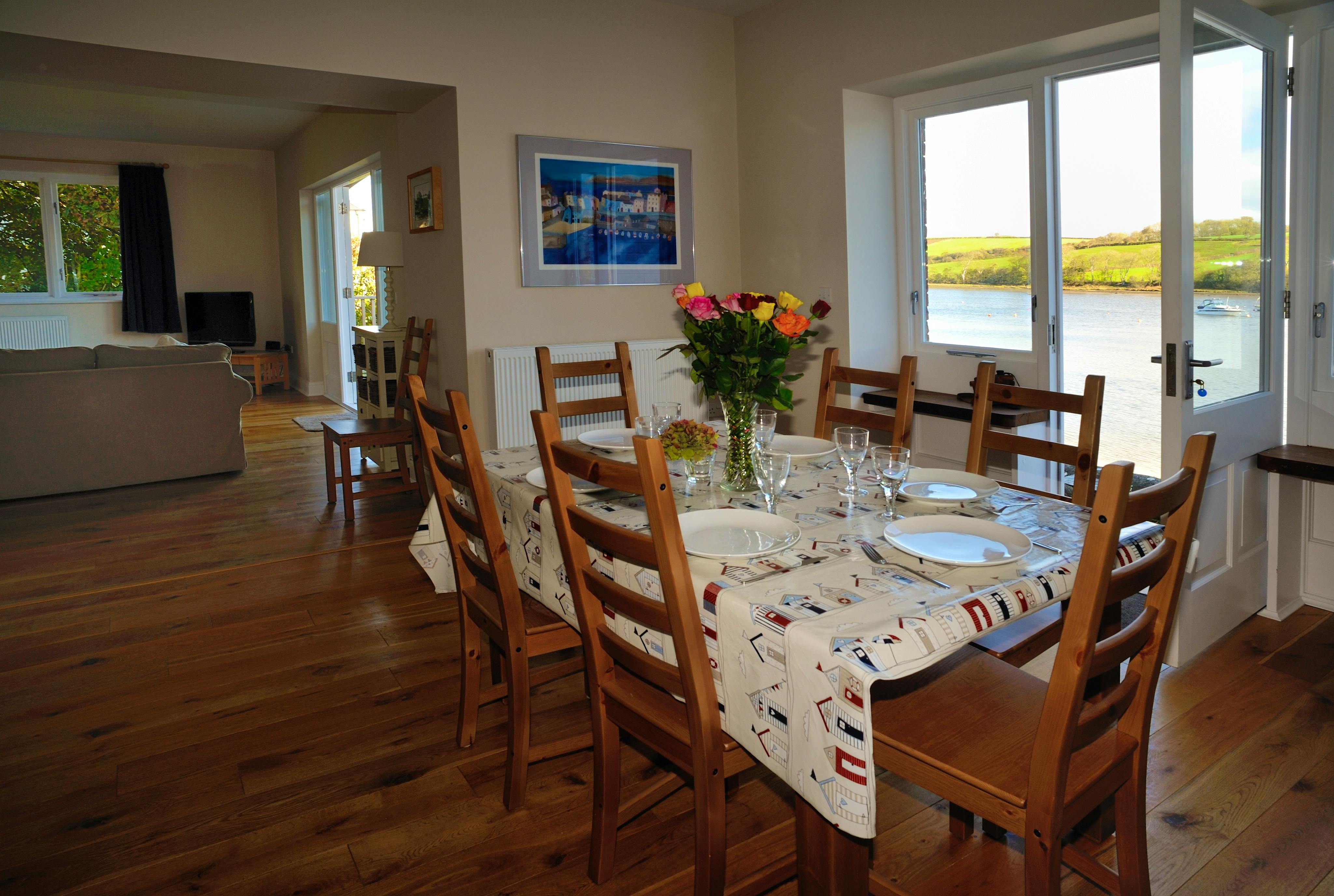 Open plan dining room with views of the tidal estuary of the River Teifi