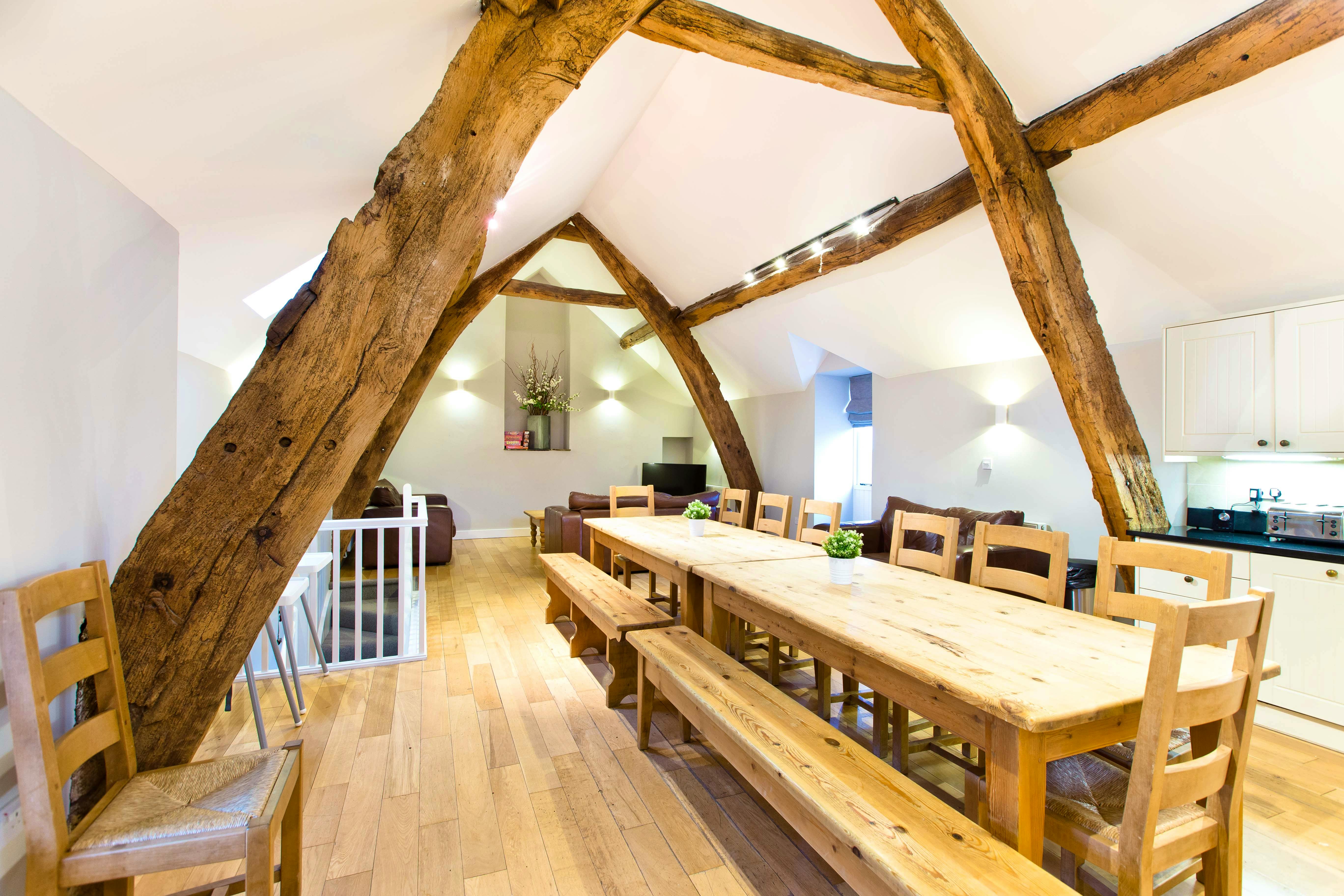 Cruck\'d barn dining space