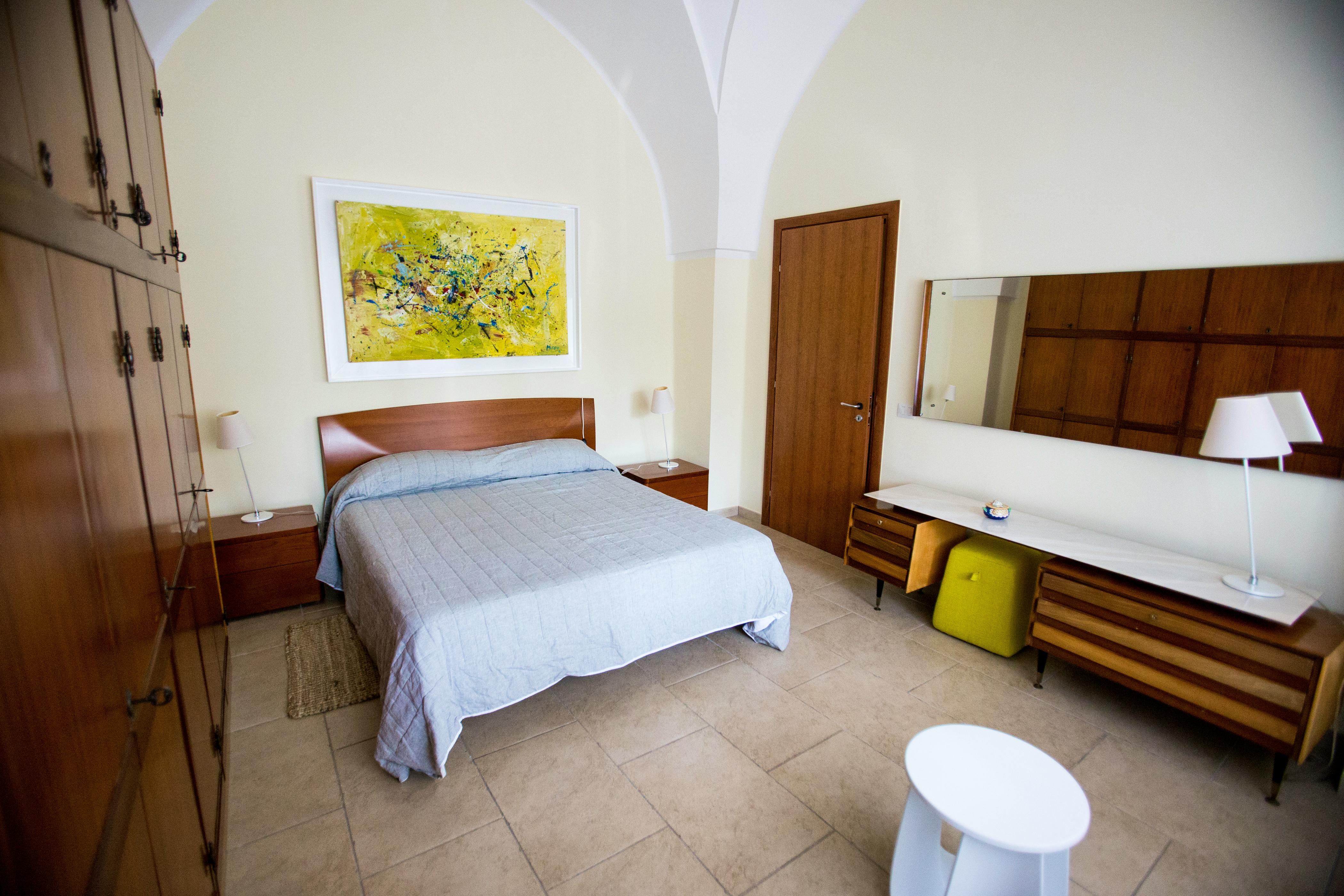 Master bedroom in one of the 3 original farmhouse rooms. Boasts a combination of modern, design and vintage furniture as well as local artwork.