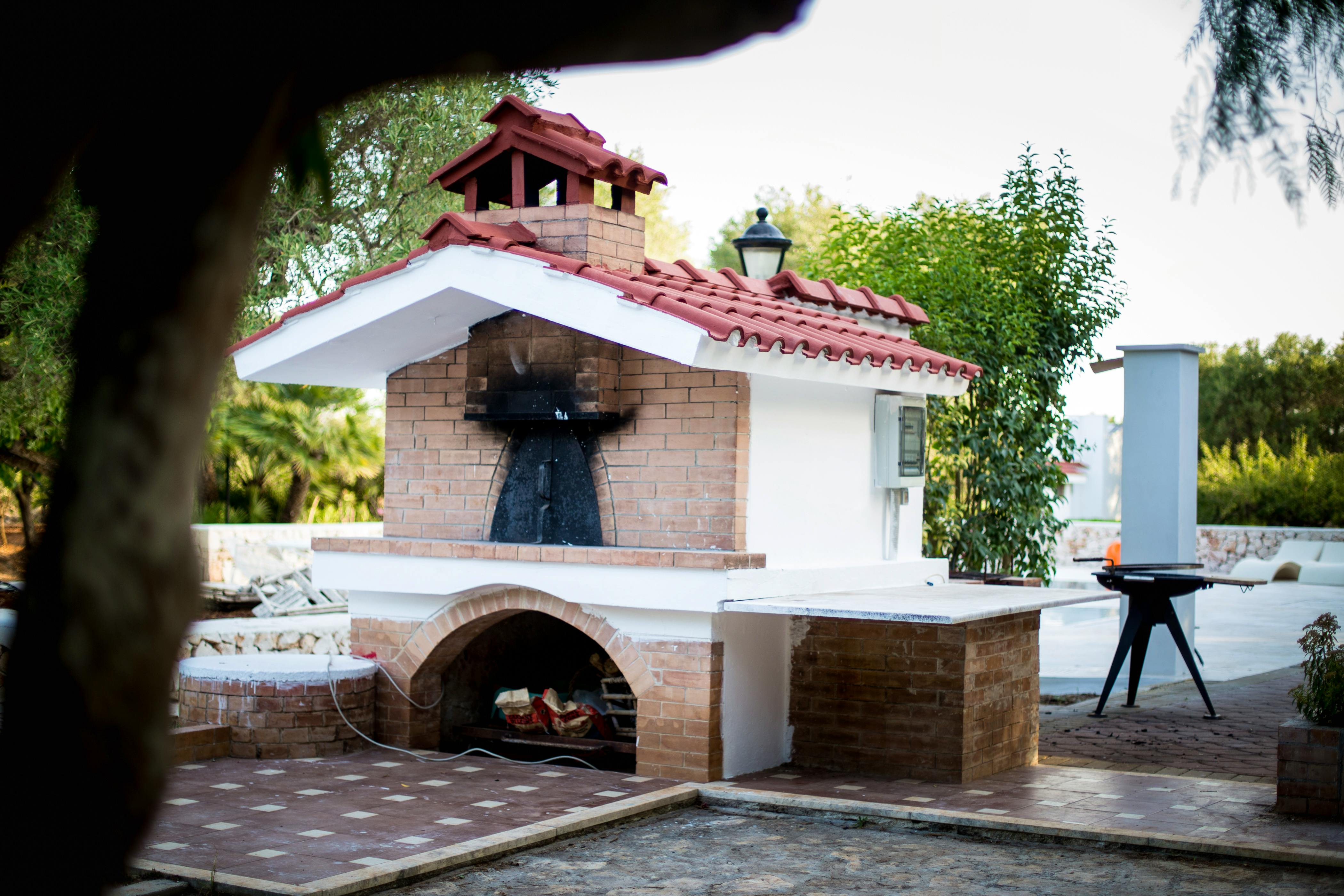 The wood-fired pizza oven and BBQ. Wood is available for free on the property.