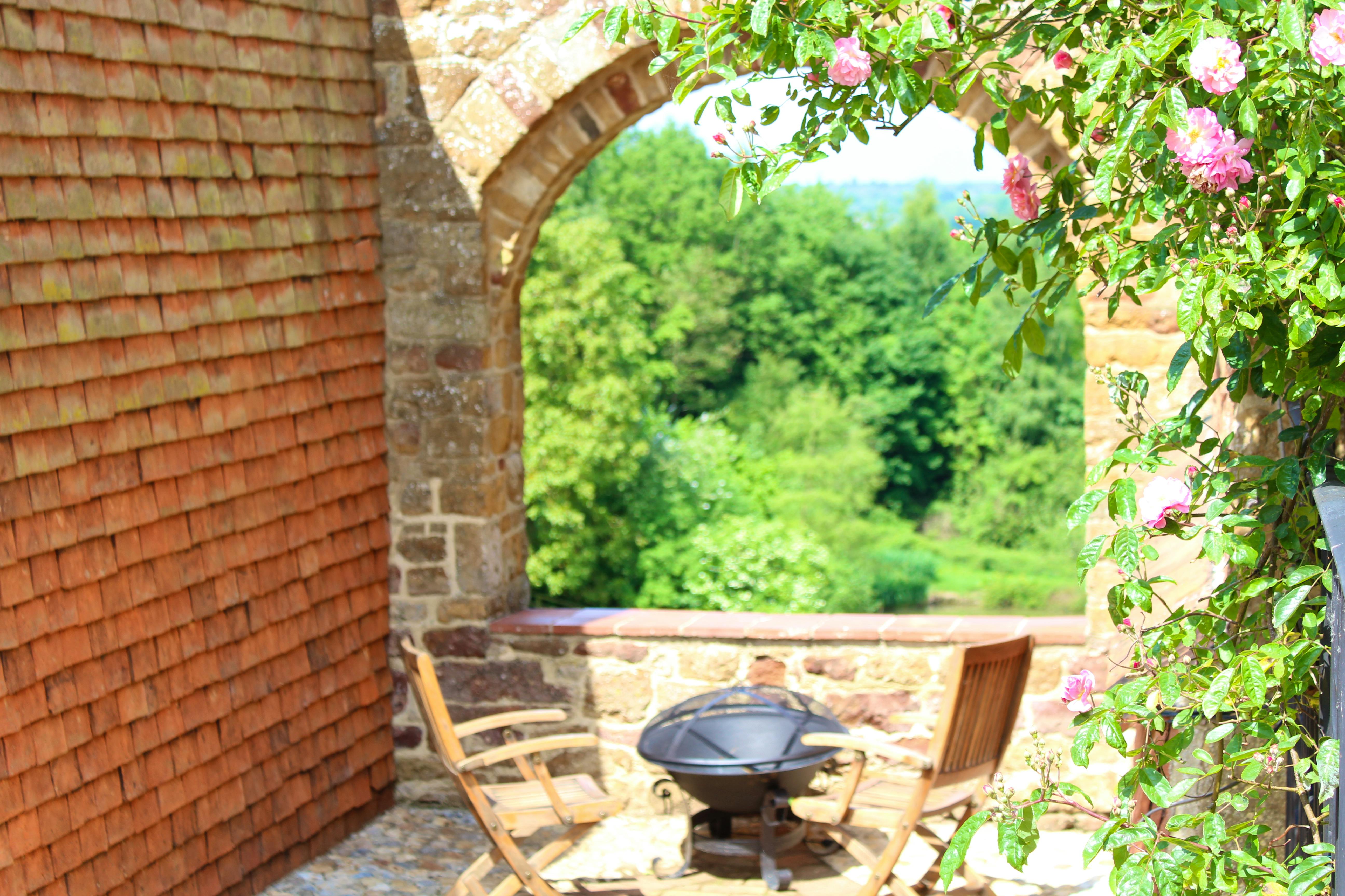 The Archway with pond and woodland beyond