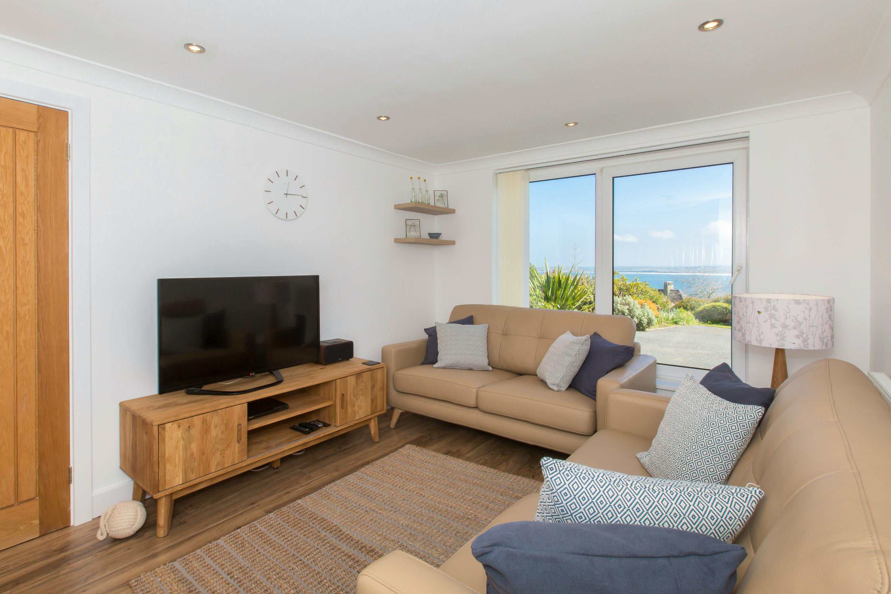 The lounge area interconnects with the kitchen diner - with more bay views