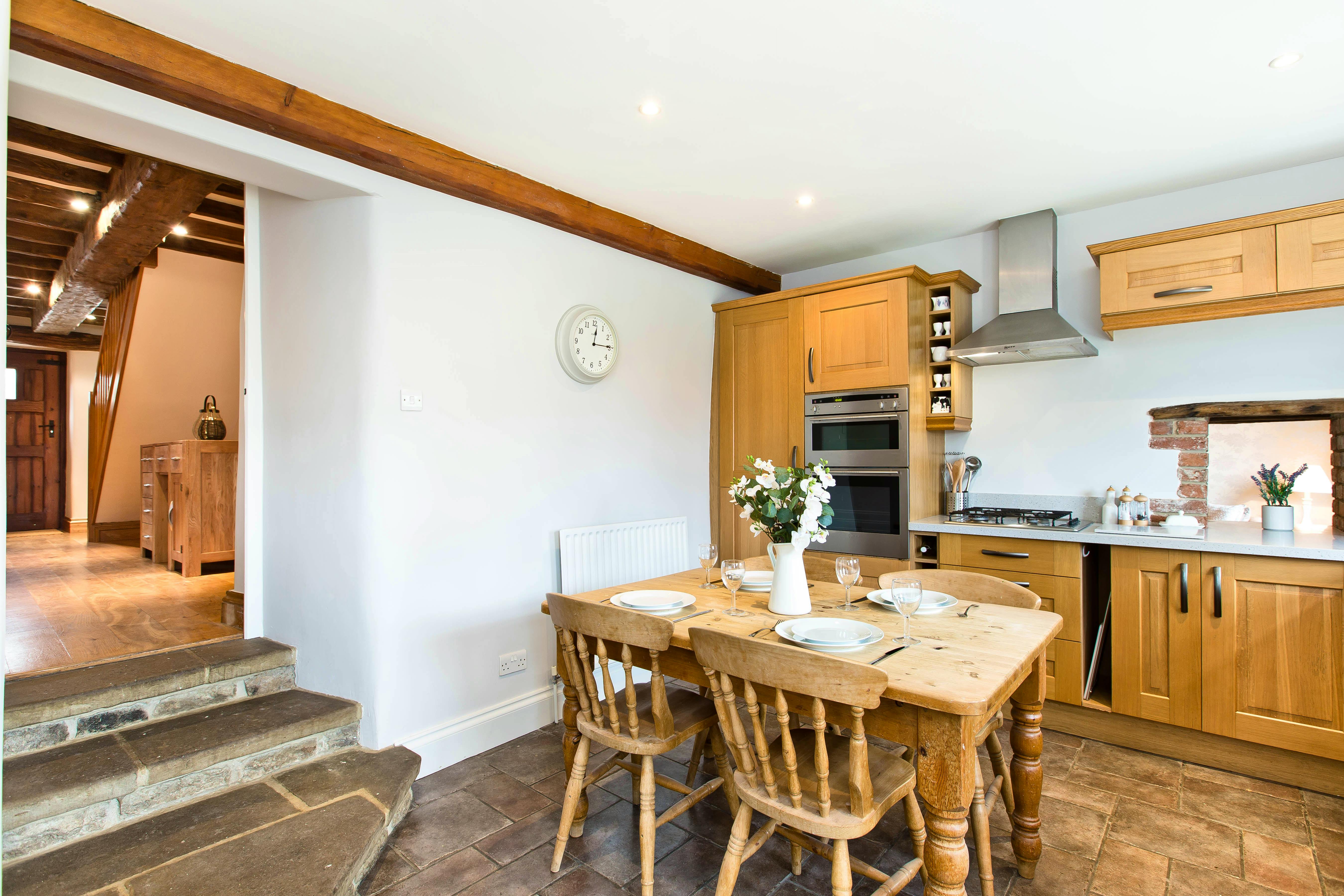 Steps from dining area into kitchen