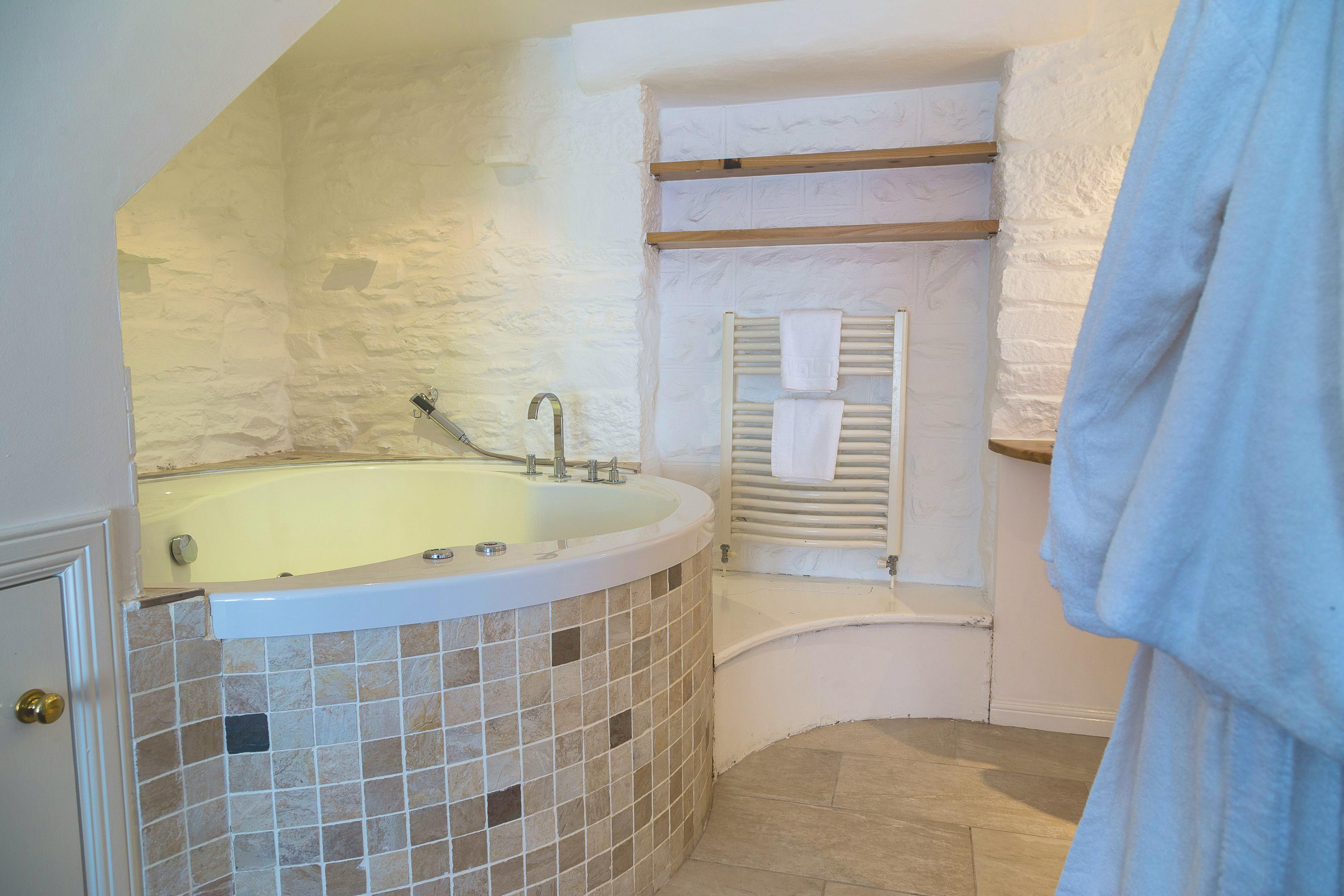 Soak away the day with a soothing bath in the Jacuzzi tub. 