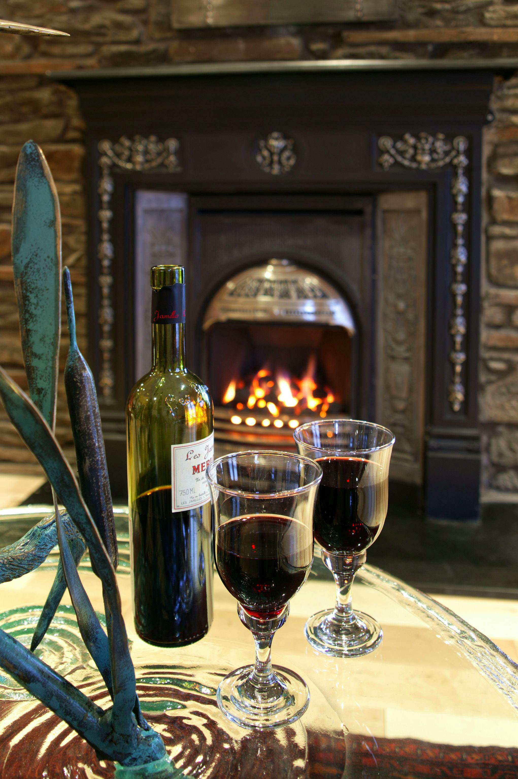 Enjoy a relaxed glass of wine by the fire. 