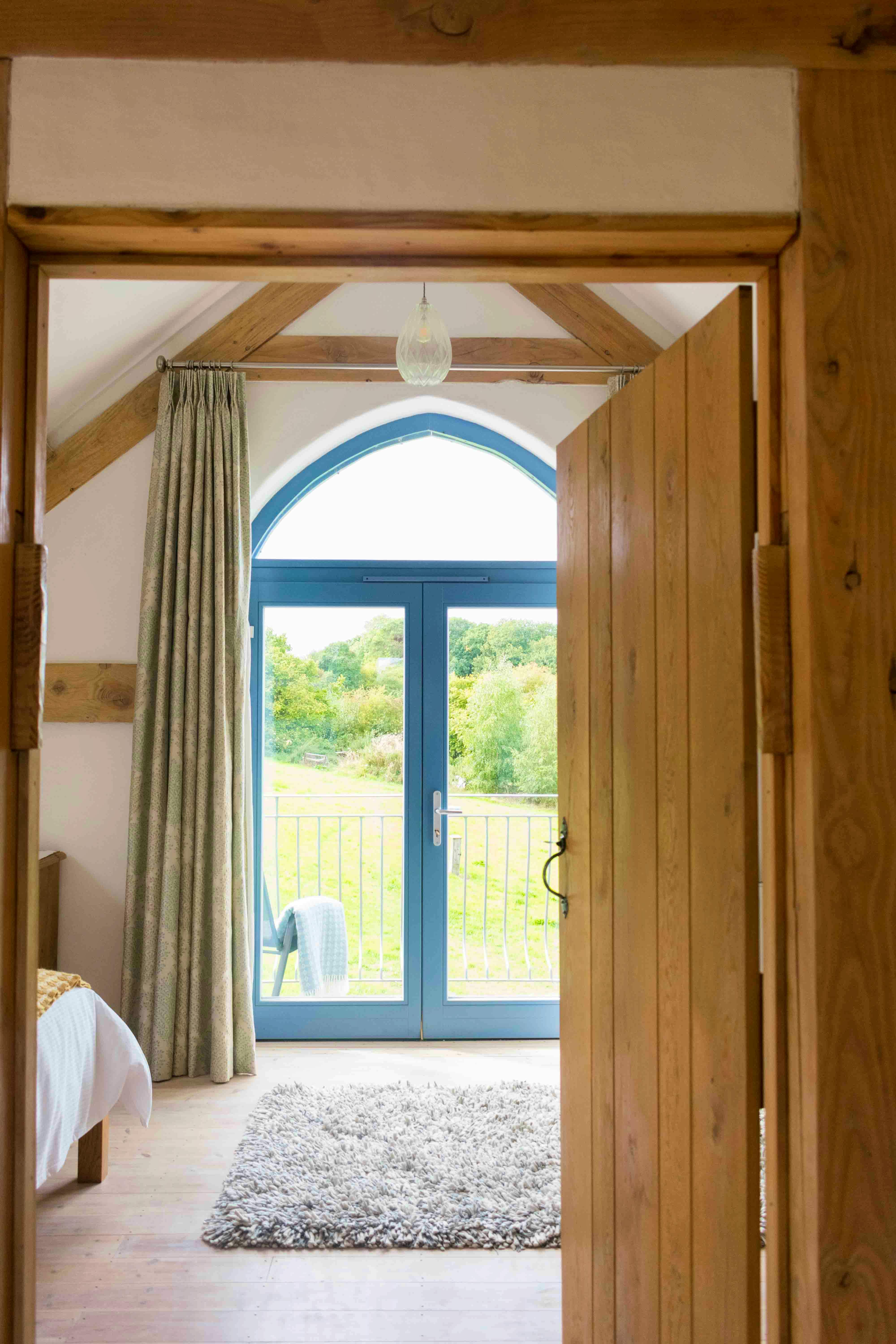 upstairs hall with balcony view