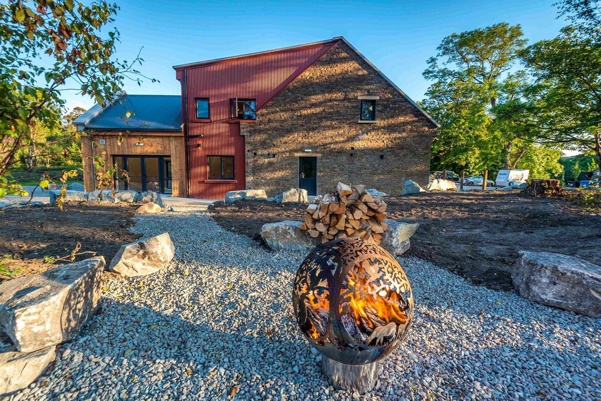 OUTDOOR FIRE IT LOOKING BACK ONTO BUILDING