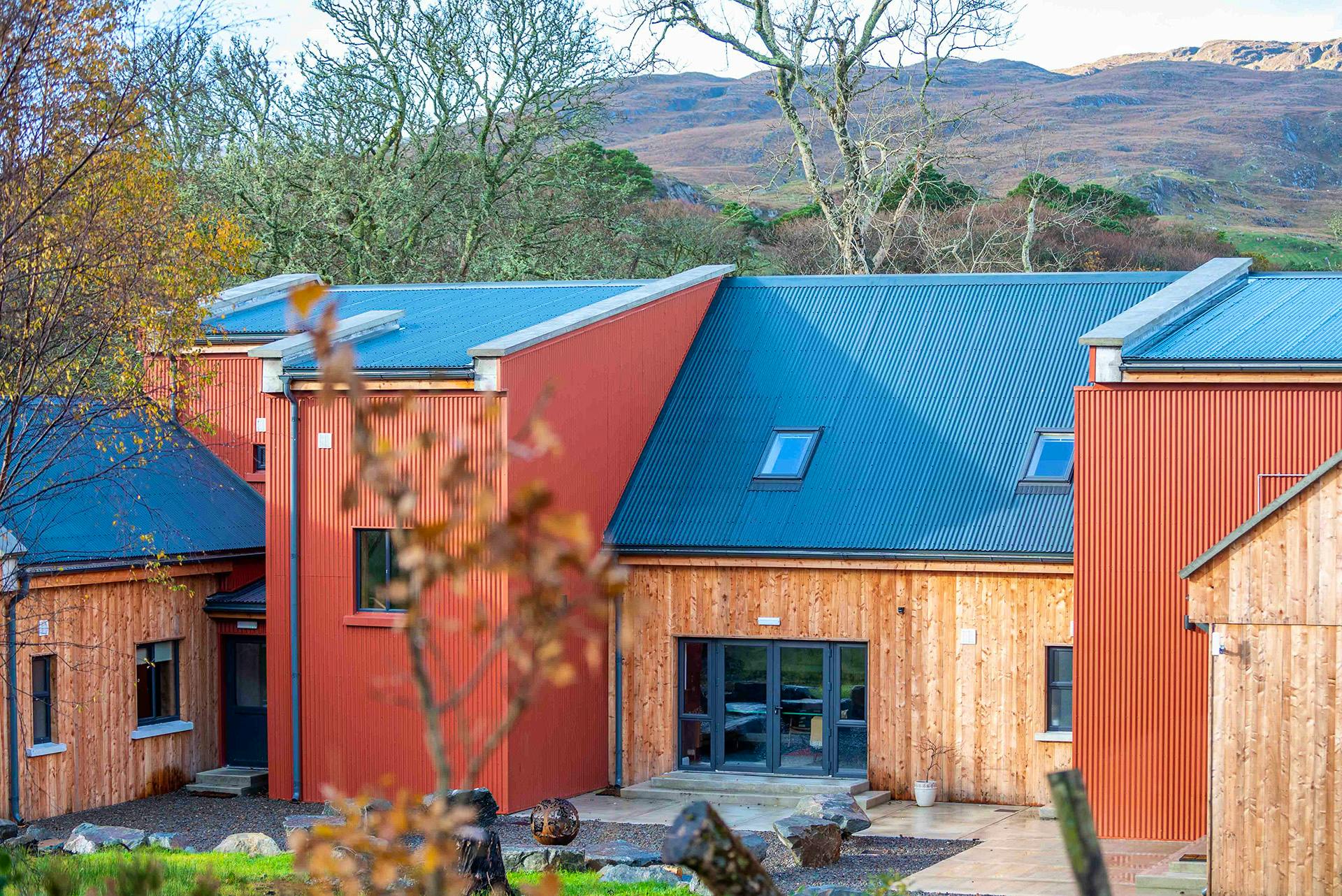 REAR ELEVATION SHOWING MOUNTAIN SETTING