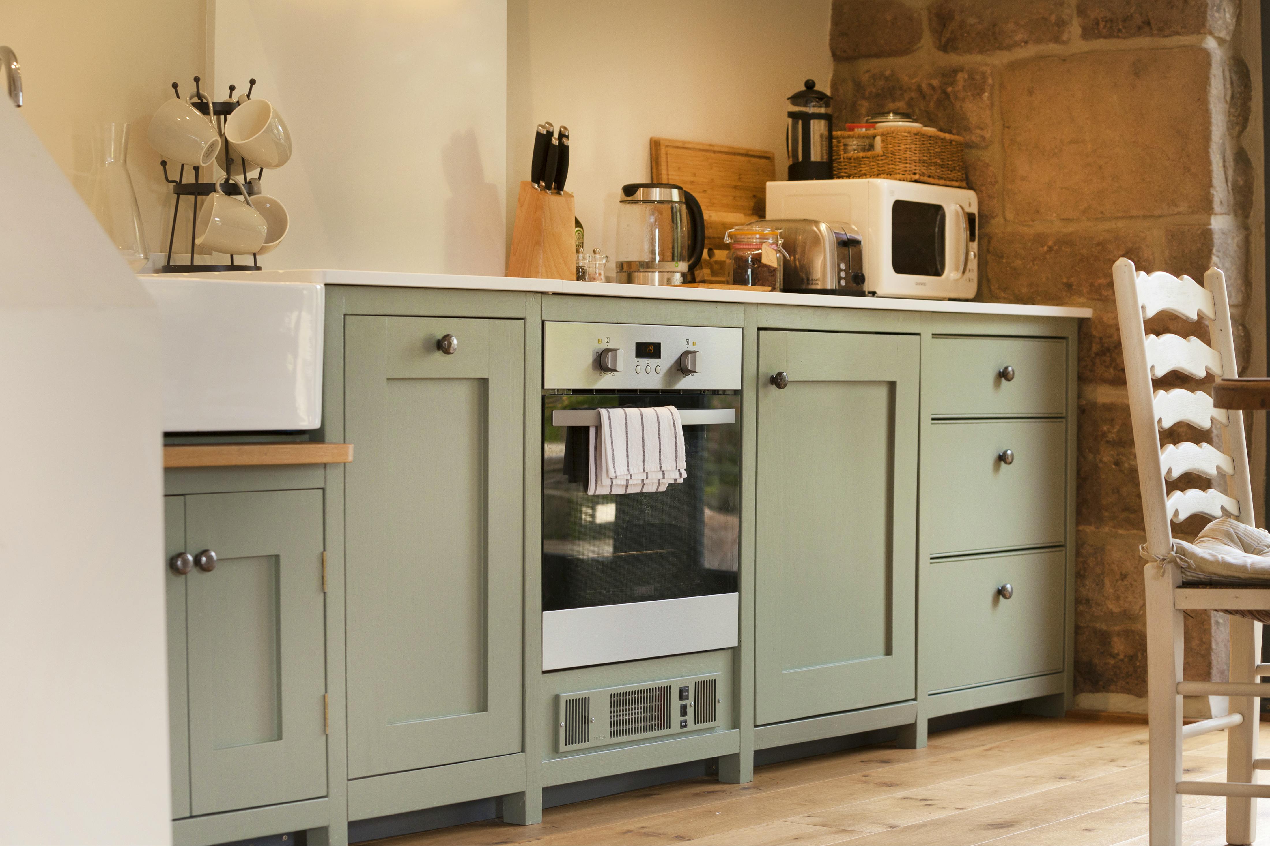 Fitted kitchen with dishwasher, fridge and induction hob