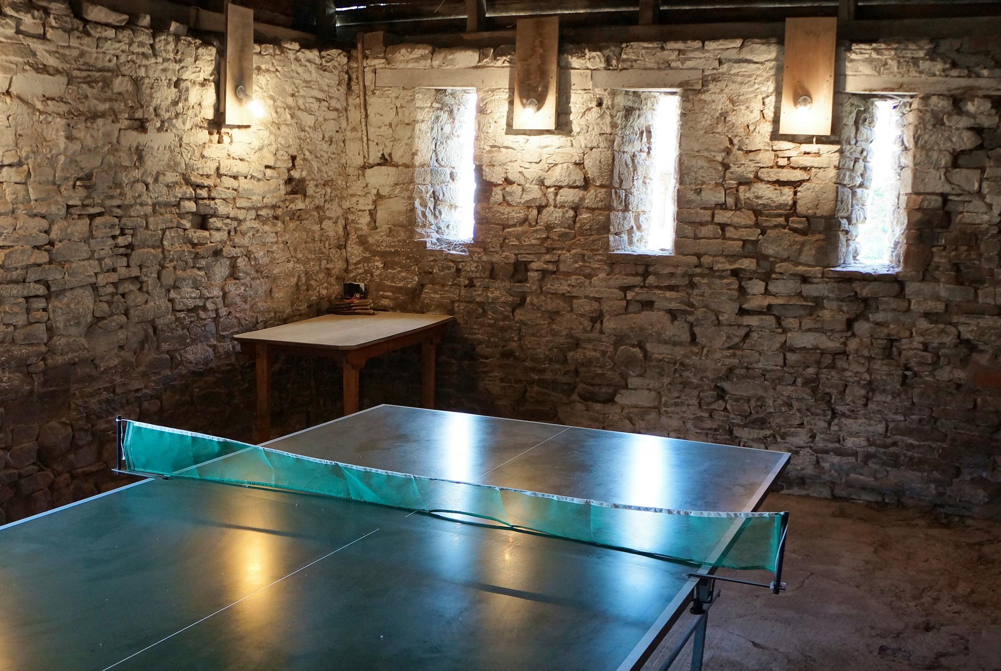 Rustic table tennis in outbuildings